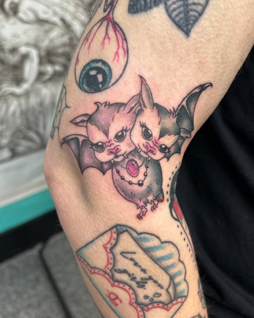 Bat couple American traditional tattoo on the forearm by Jayda Shell