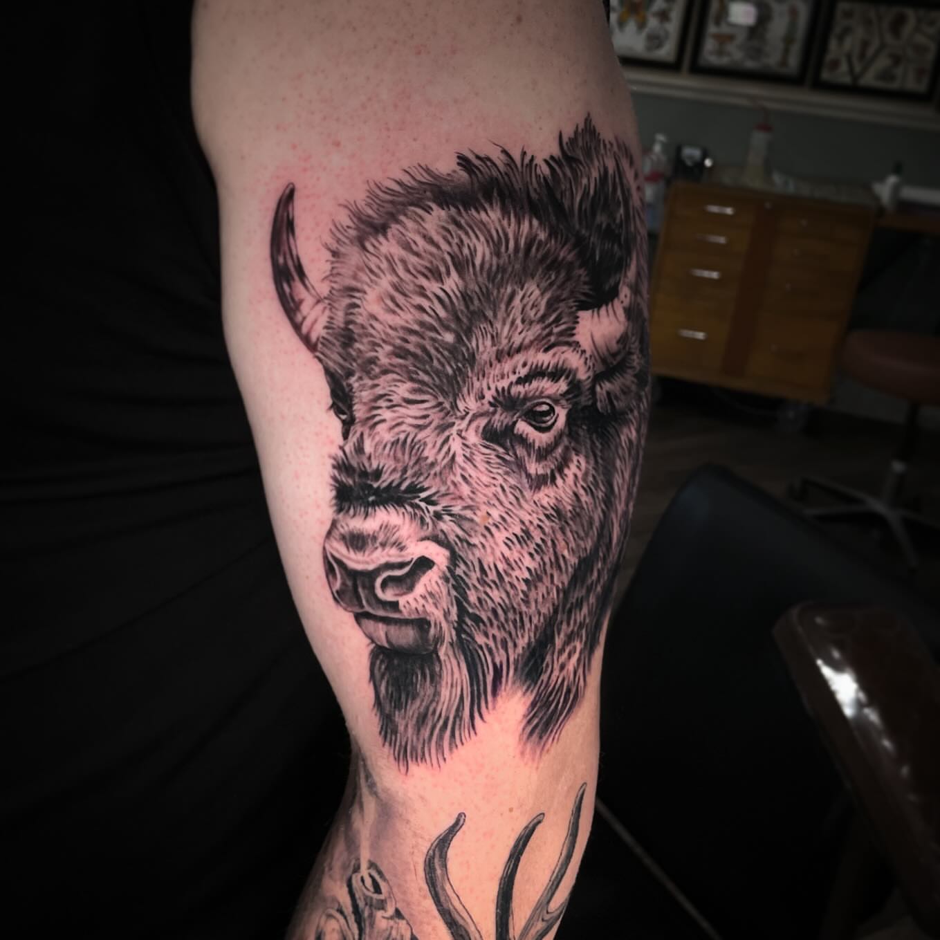 Buffalo realism tattoo on the forearm by Caleb Baker