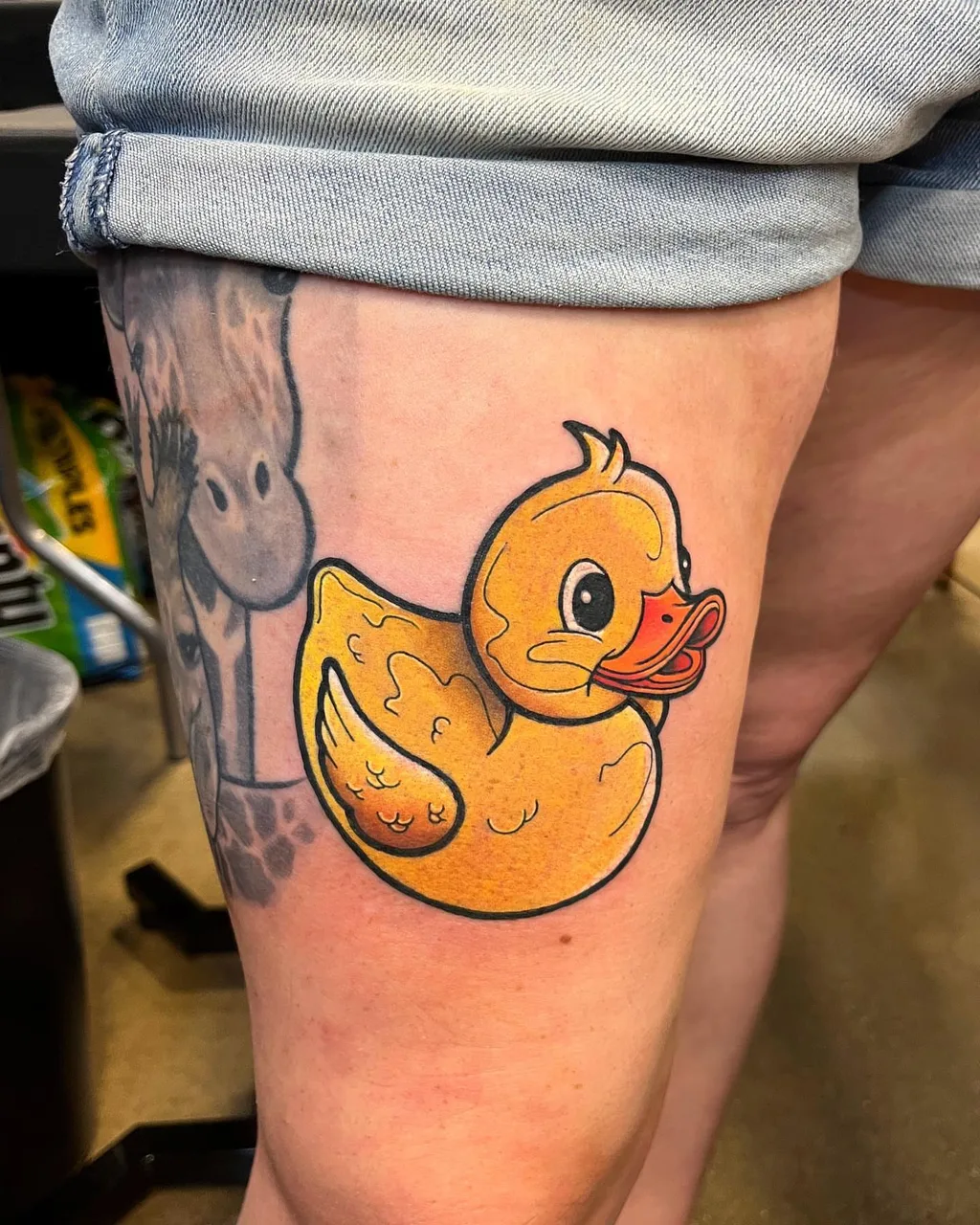 Rubber duck new school tattoo on the thigh by Adam Silfies