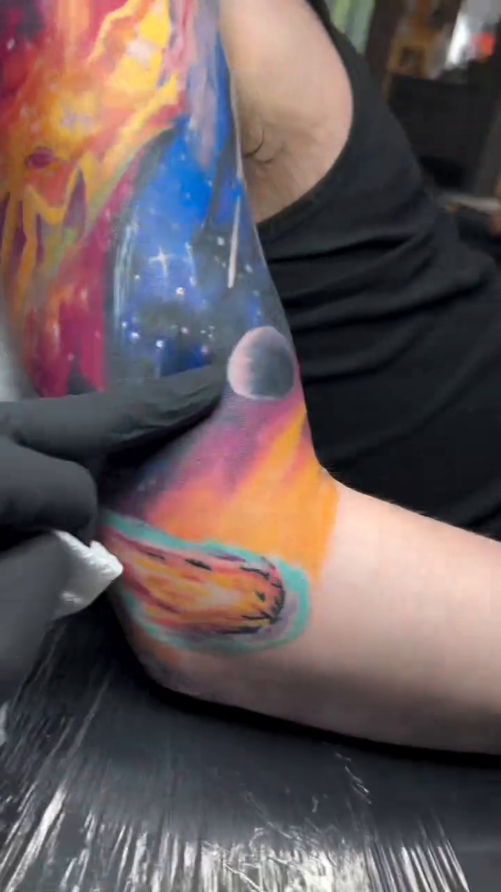 Cosmic scene with planets and nebulae realism tattoo by Matt Trimble, Charlotte, North Carolina