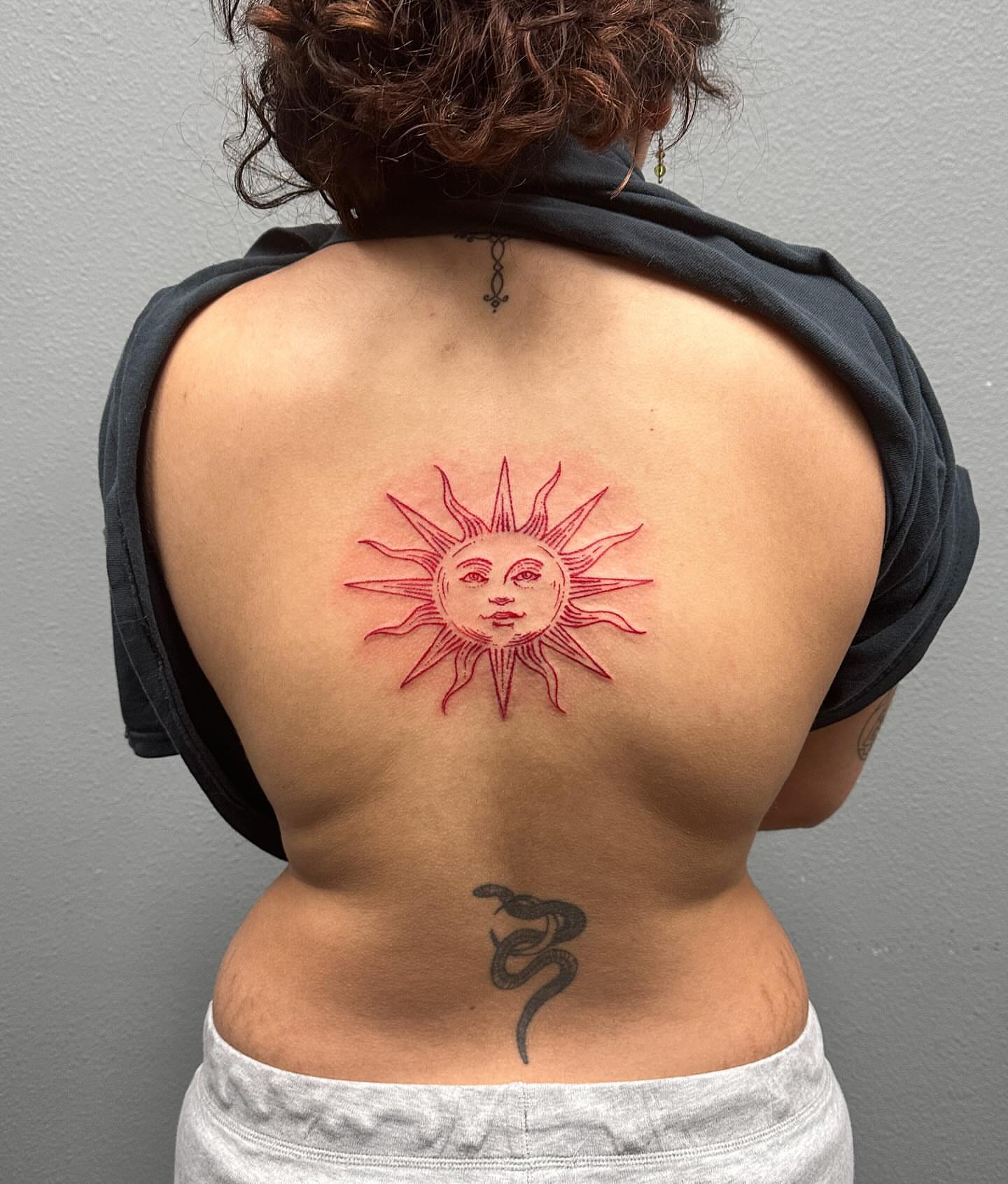 Sun new school tattoo on the back by Portland Tattoo Artist