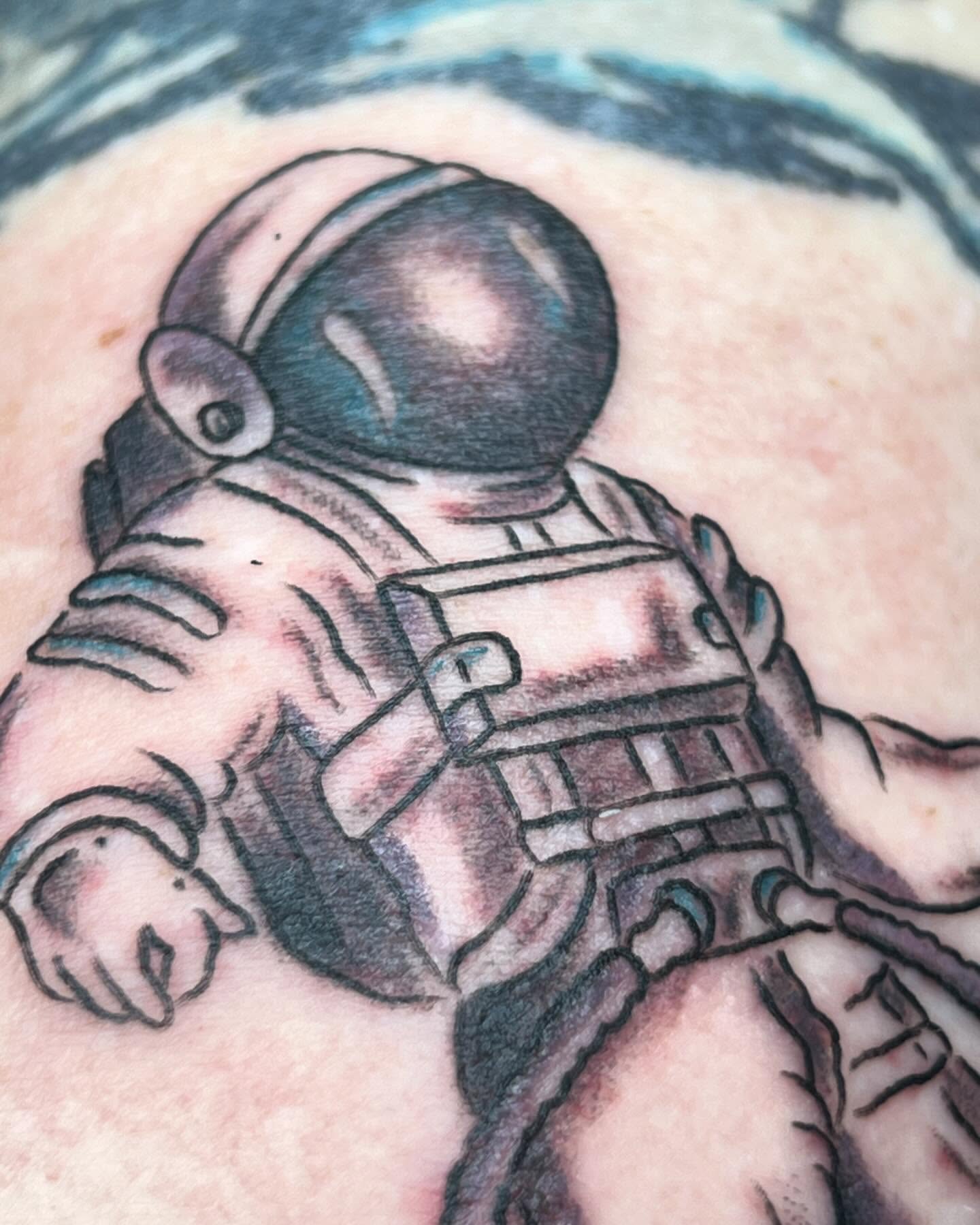 Astronaut black and grey tattoo on the torso by Cory Miller