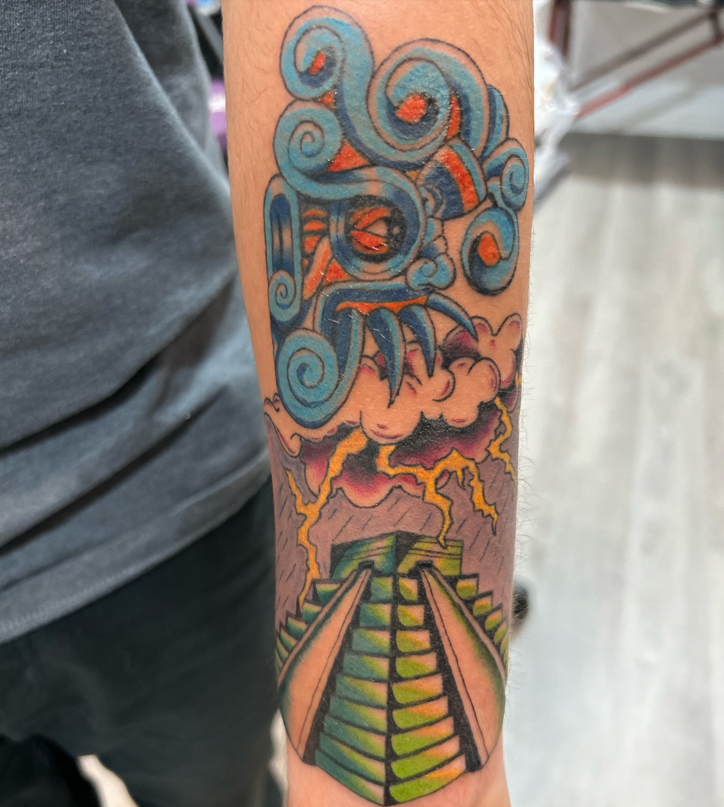 Temple and deity new school tattoo on the forearm by 🇬🇹