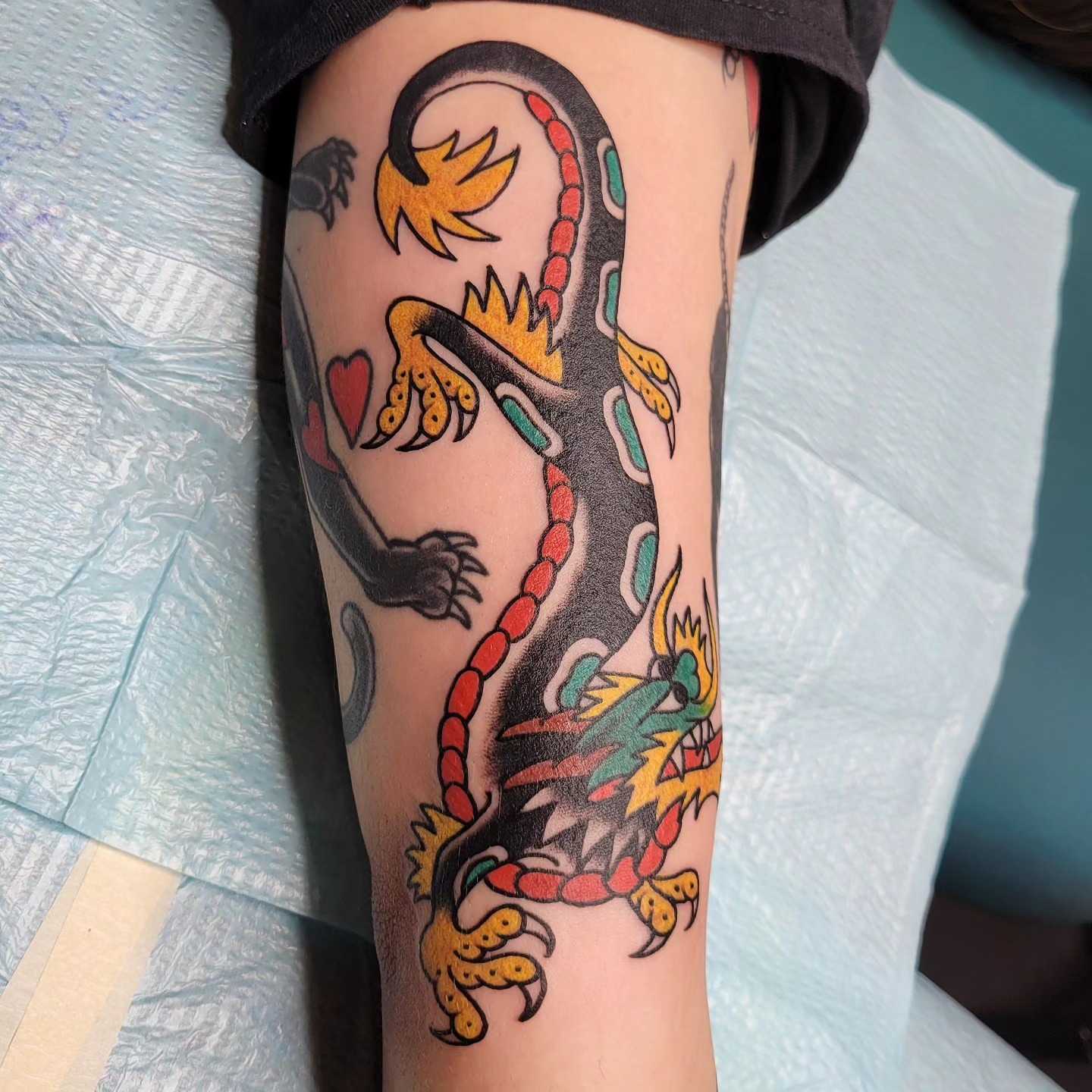 Dragon American traditional tattoo on the forearm by Jared Green