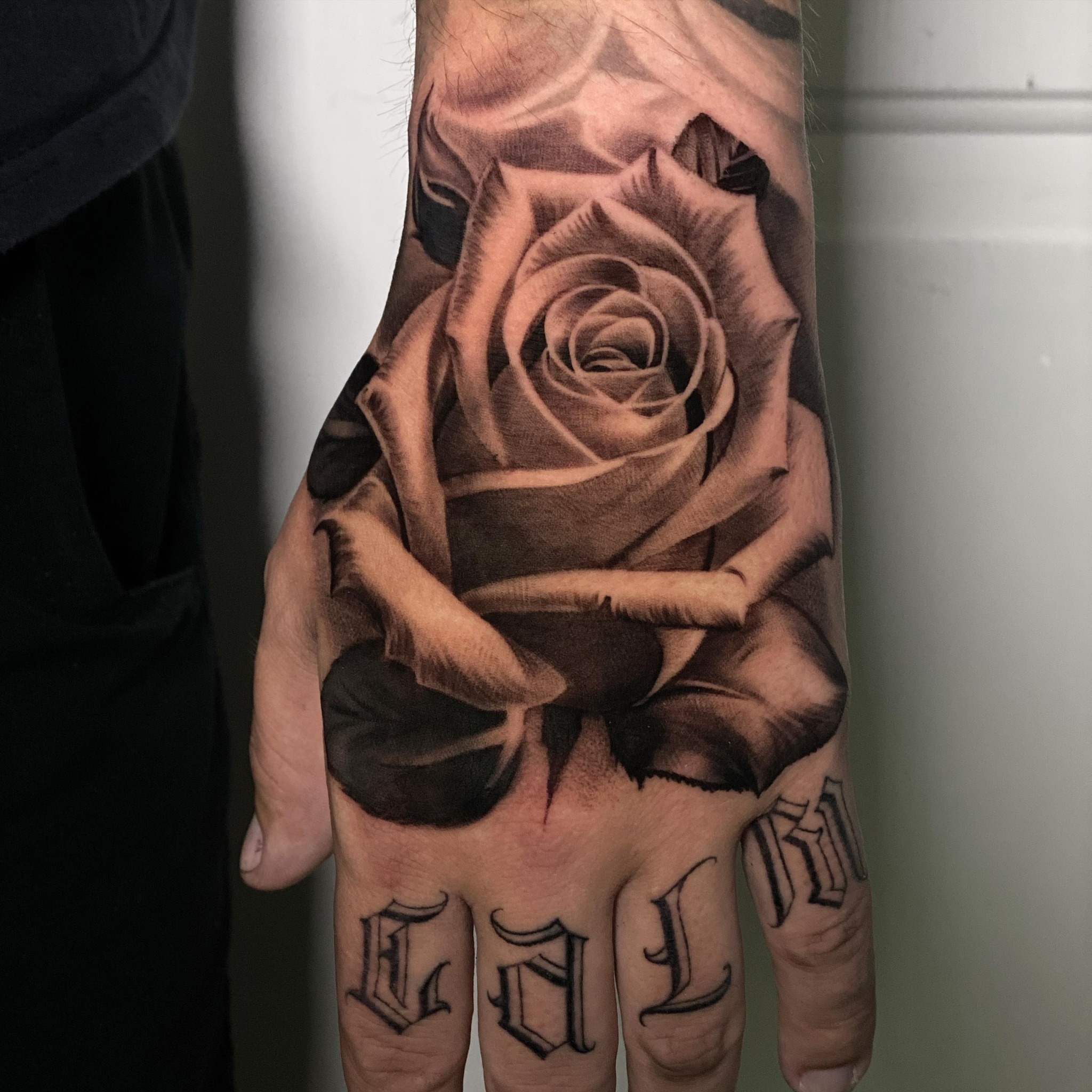 Rose realism tattoo on the hand by Sergio Mendez