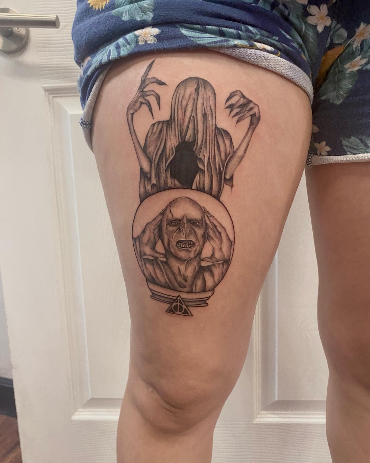 Ghostly figure with orb realism tattoo on the thigh by Lady.SINatra
