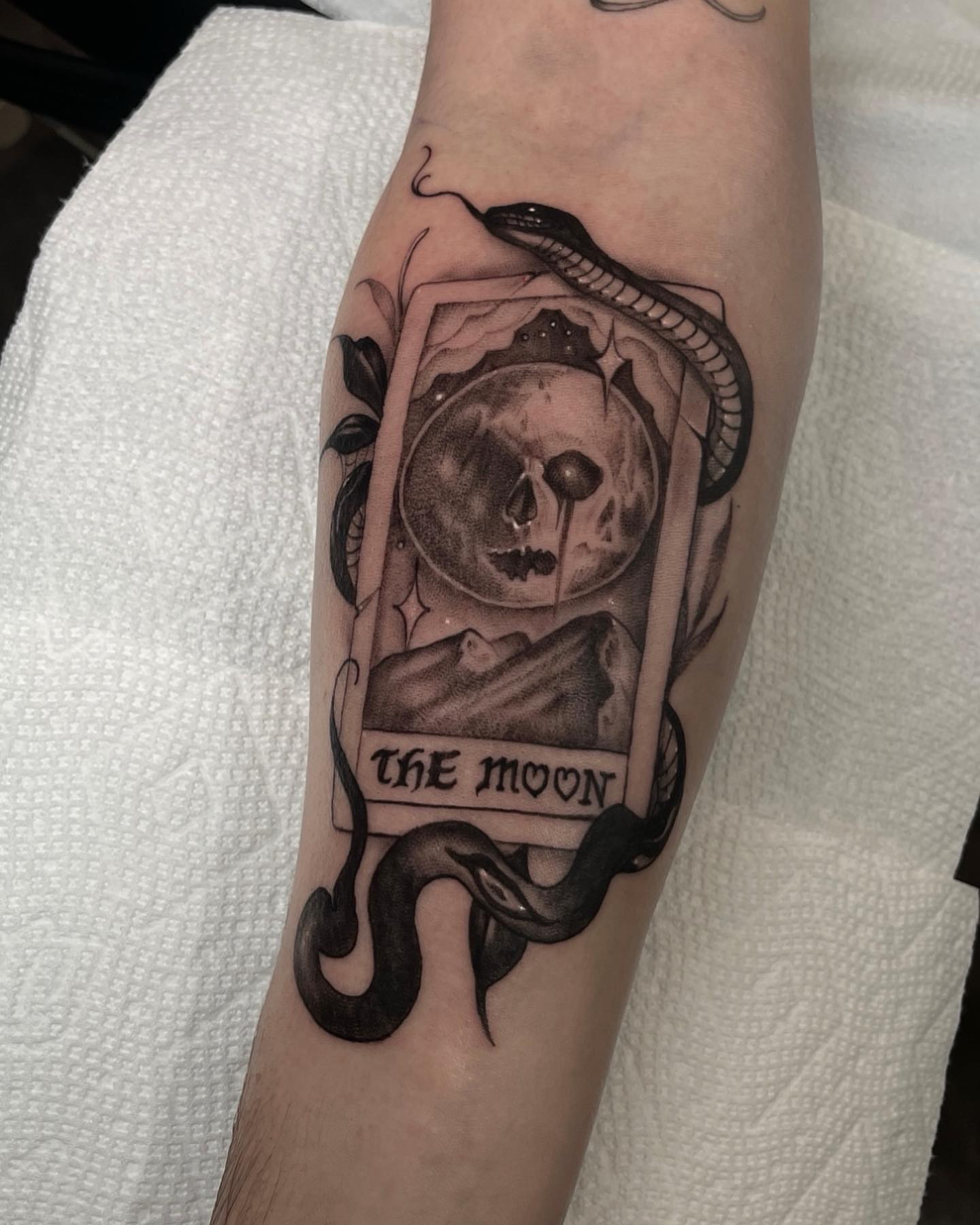 The moon tarot card realism tattoo on the forearm by Morrison Vo