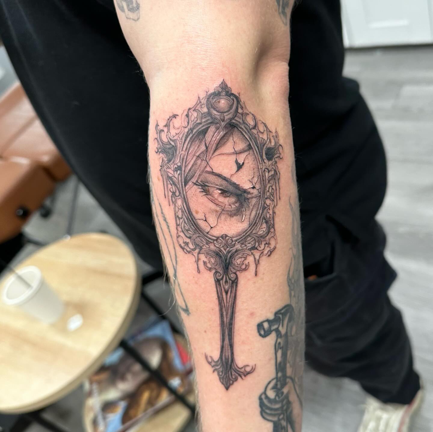 Eye in ornate frame realism tattoo on the forearm by ꧁༒