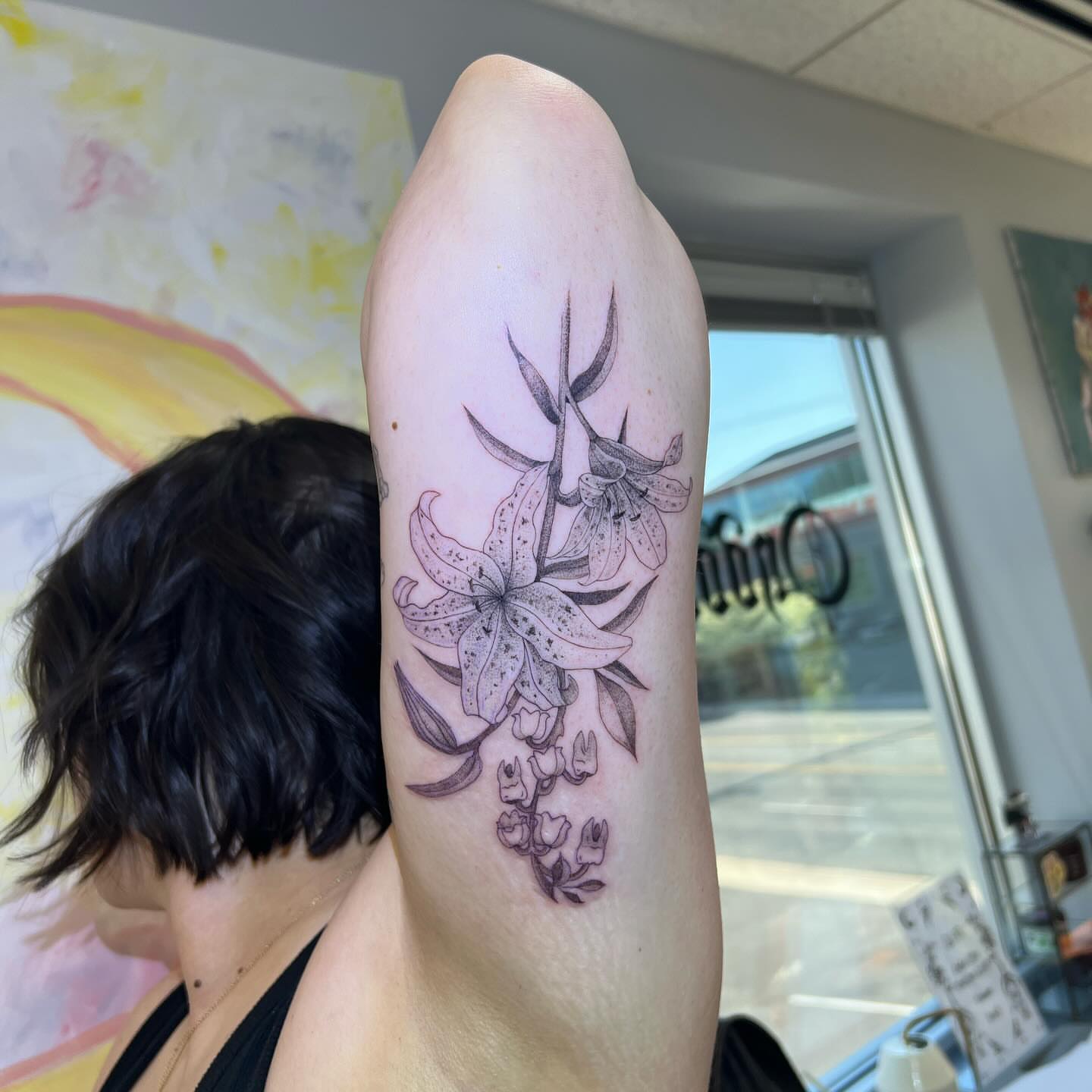 Lily flowers dotwork tattoo on the forearm by ꧁༒