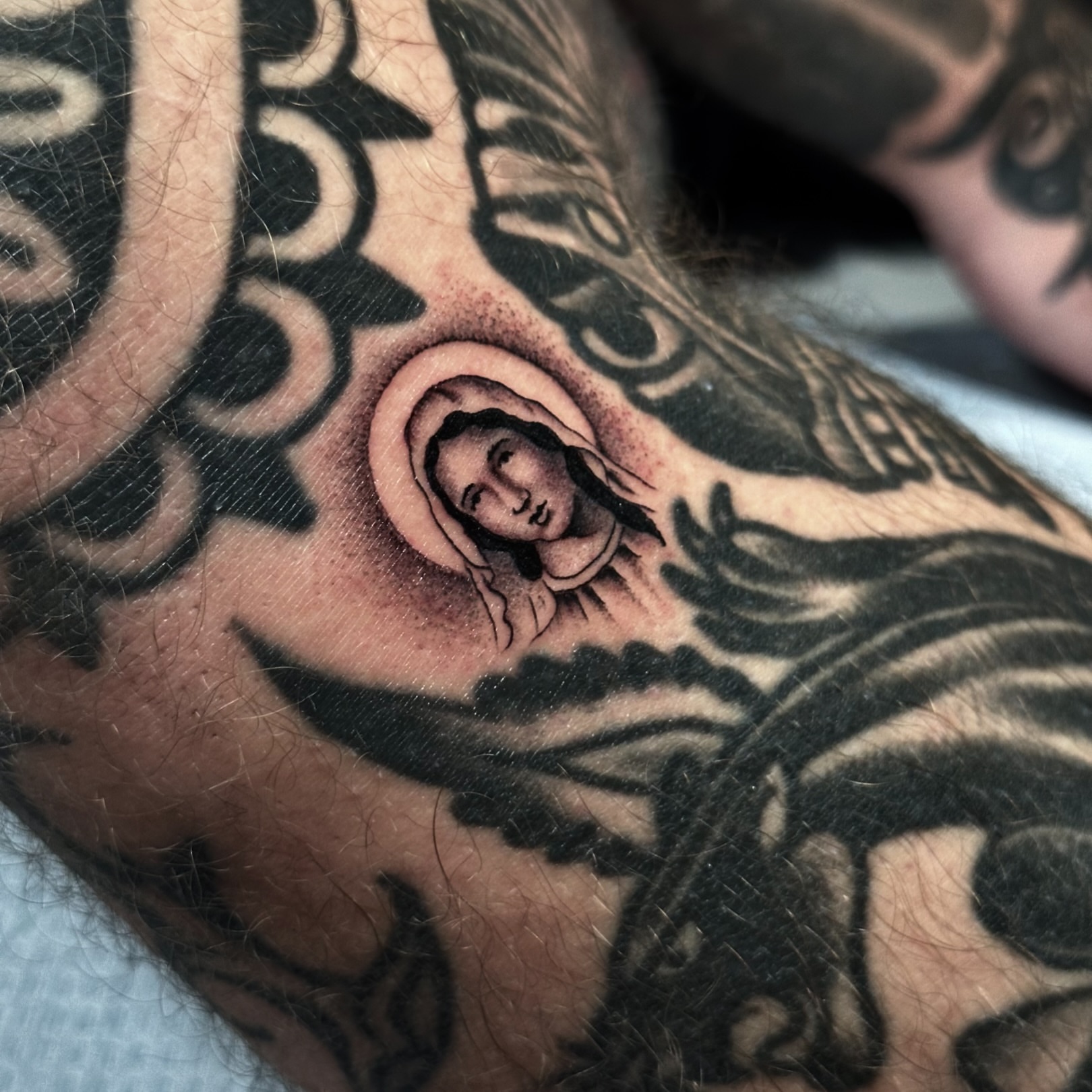 Religious figure black and grey tattoo on the forearm by Matthew, Georgetown, Texas