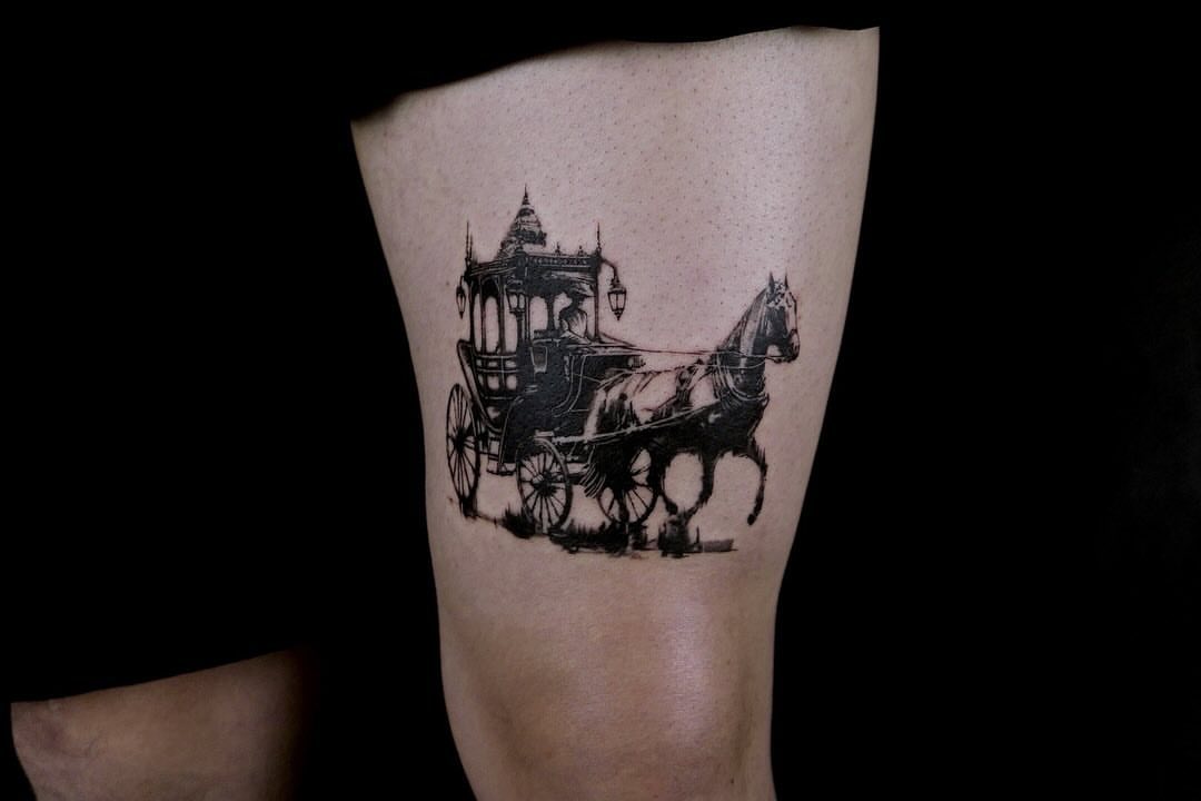 Horse-drawn carriage black and grey tattoo on the forearm by 𝑴𝒆𝒍𝒐