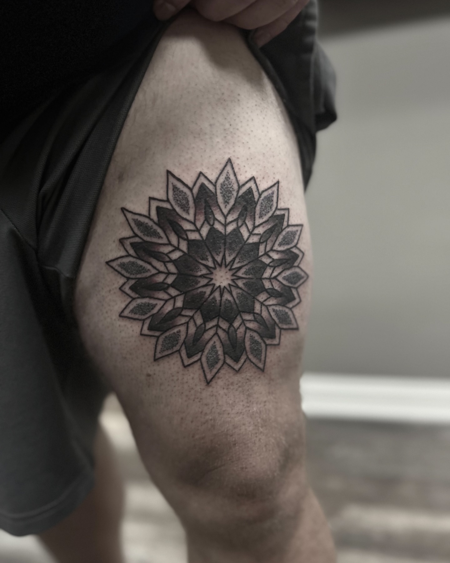 Geometric mandala geometric tattoo on the thigh by Eric Hare