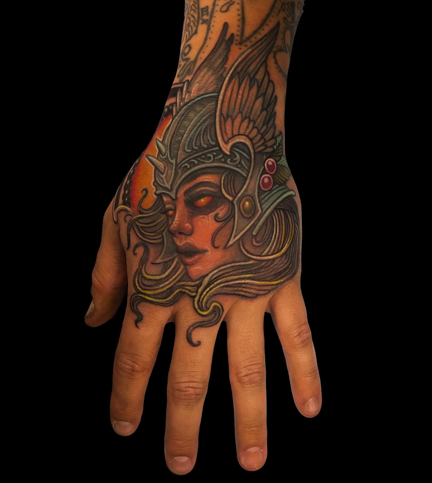 Woman warrior helmet illustrative tattoo on the hand by Brett Herman, Denver, Colorado