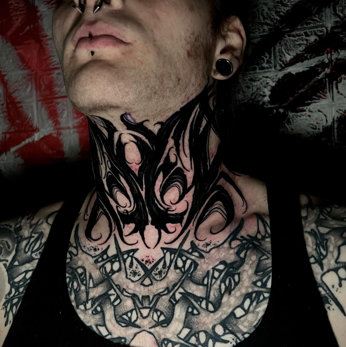 Abstract design black and grey tattoo on the neck by Tucker, Maryville, Tennessee