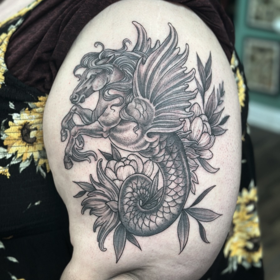 Pegasus and flowers black and grey tattoo on the shoulder by Patricia Cunningham