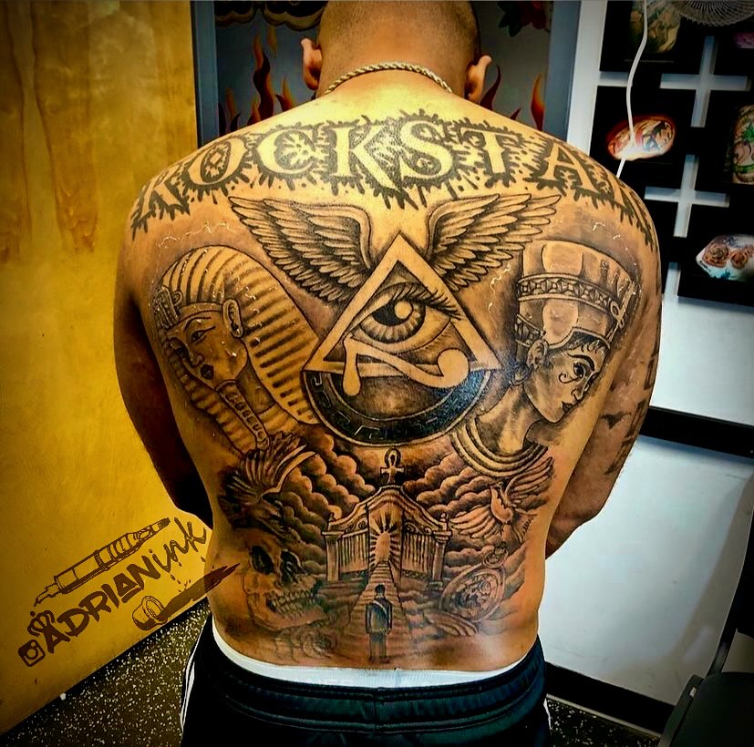 Eye of providence black and grey tattoo on the back by Adrian Shan Carr