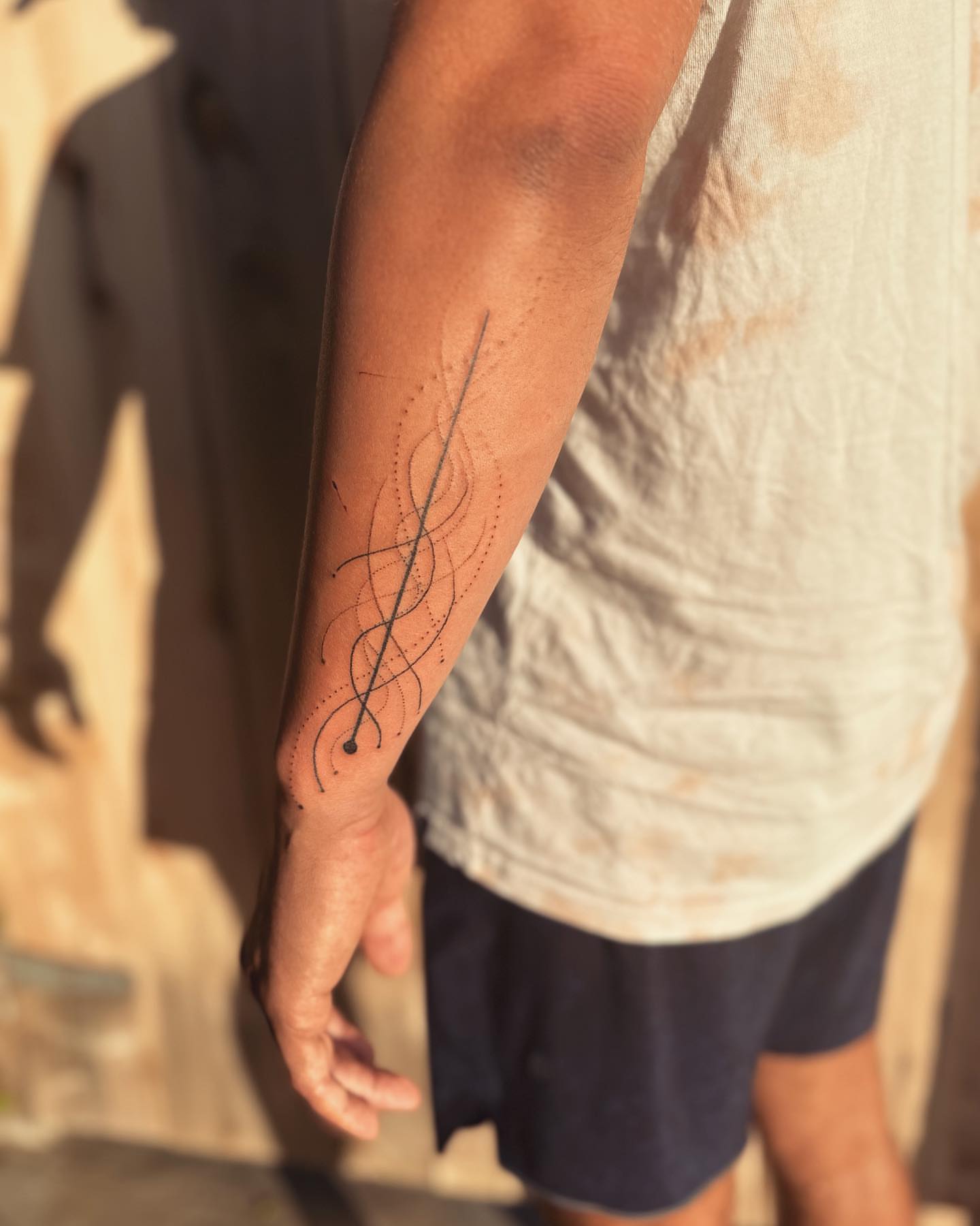 Abstract swirls dotwork tattoo on the forearm by Gaya