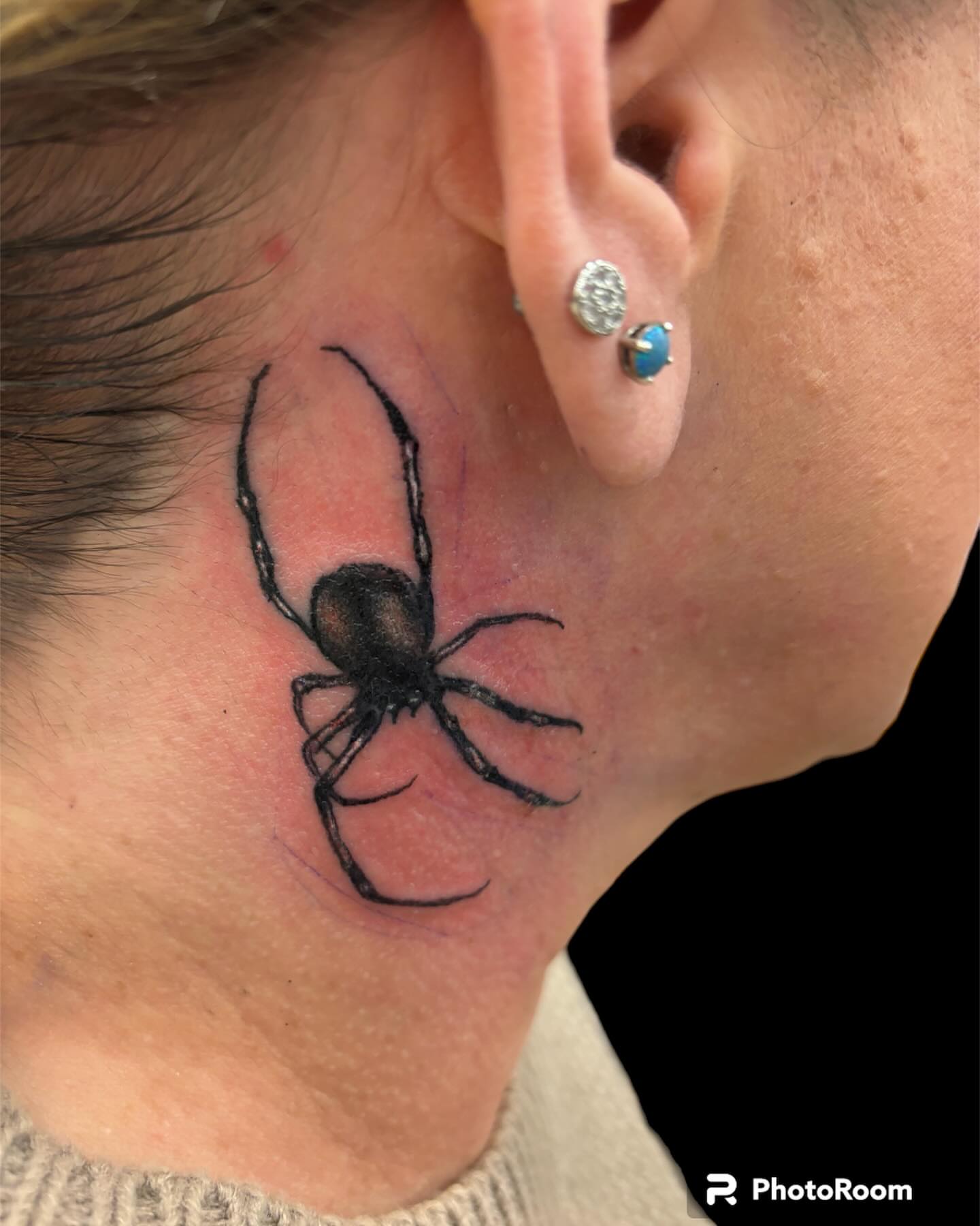 Spider black and grey tattoo on the neck by Dale Martin