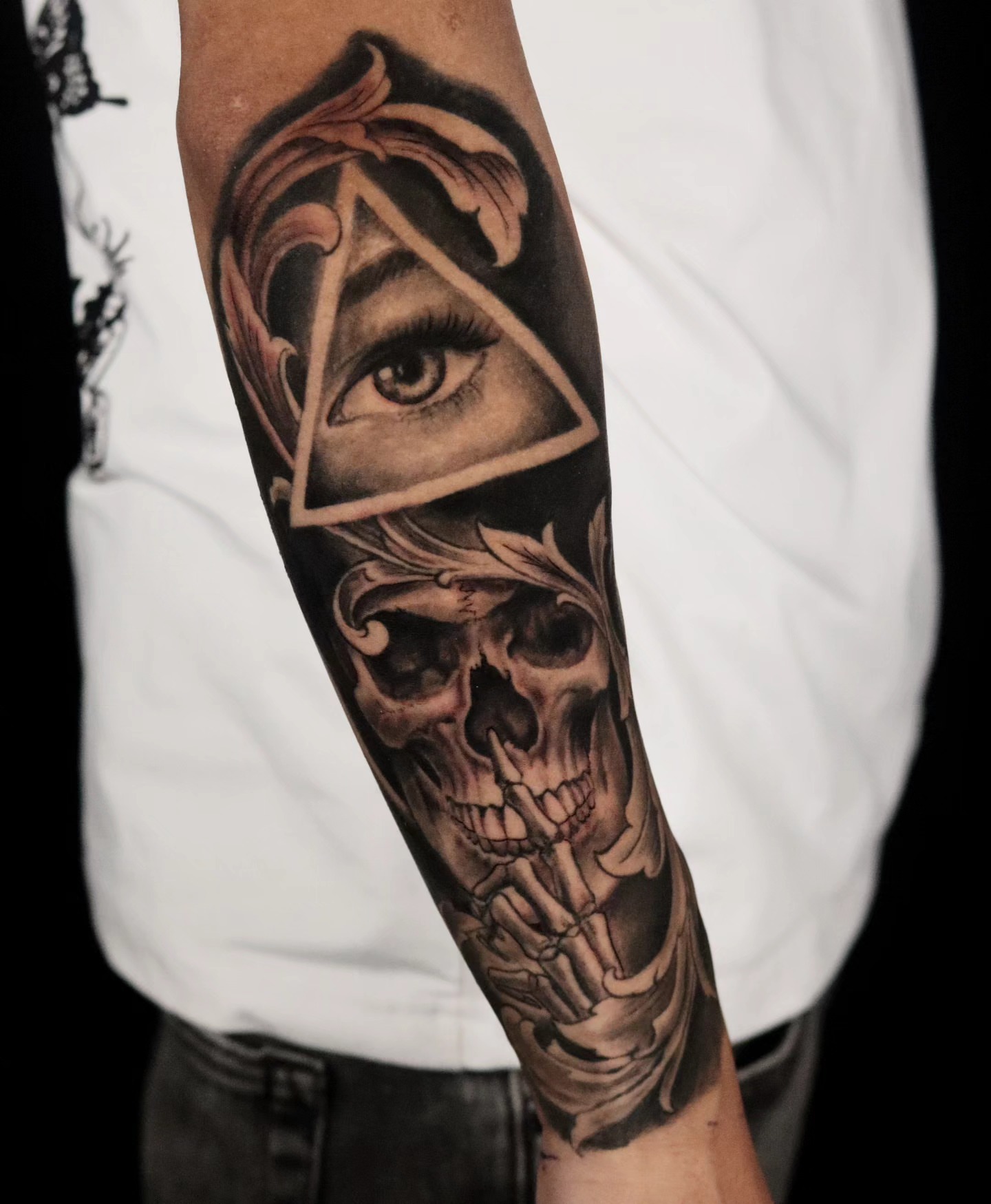 Eye and skull realism tattoo on the forearm by Brandon Rabago, Fort Worth, Texas