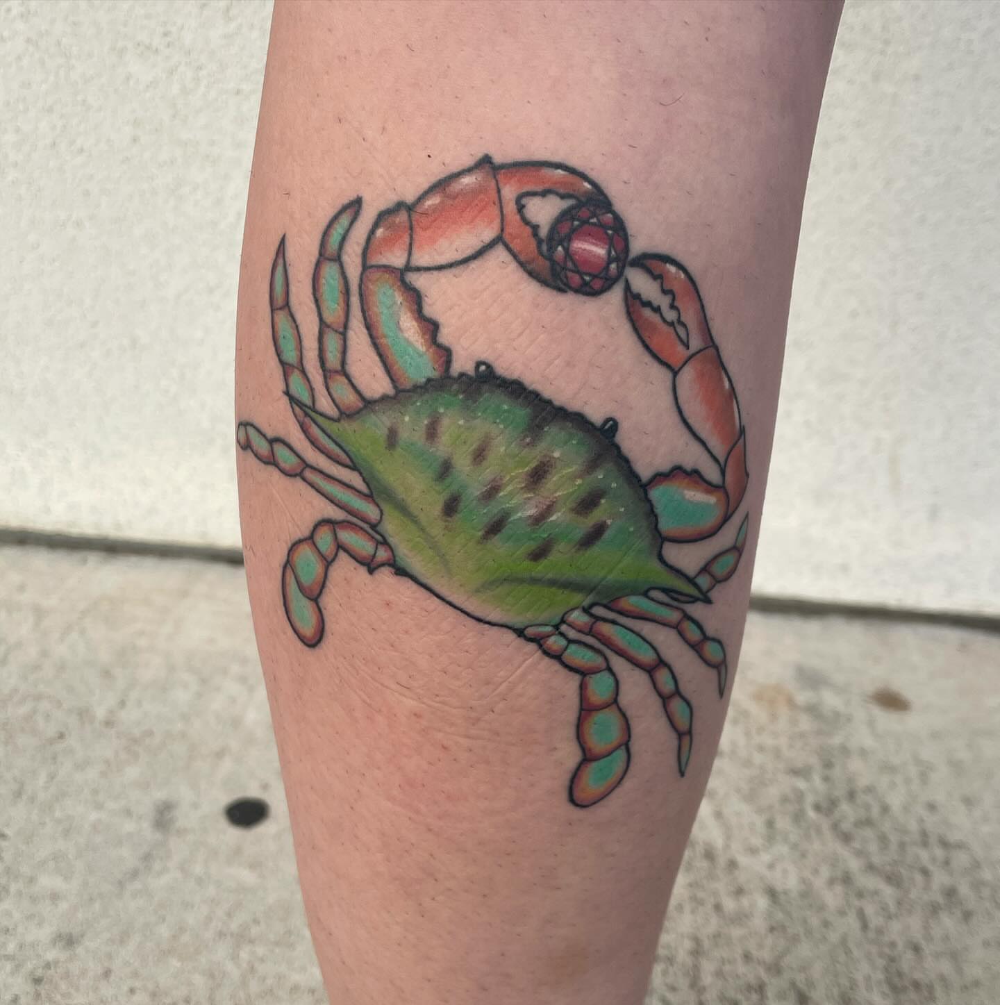 Crab American traditional tattoo on the forearm by Michelle