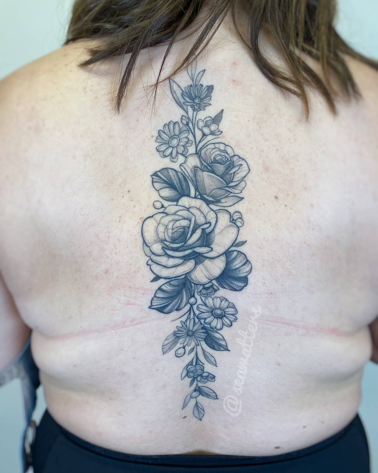 Floral bouquet black and grey tattoo by Caitlin Watters