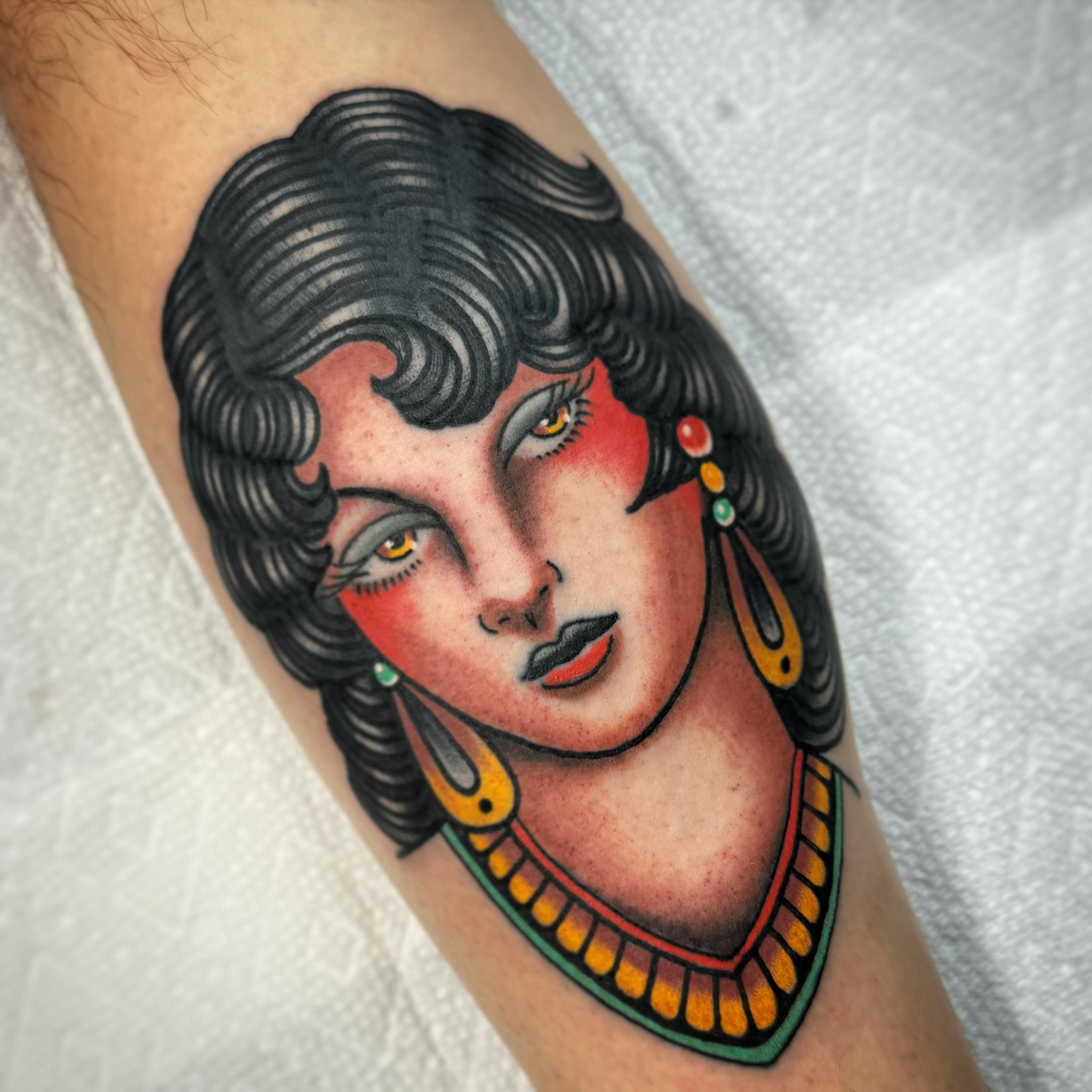 Woman American traditional tattoo on the forearm by Drew McElveney, Austin, Texas