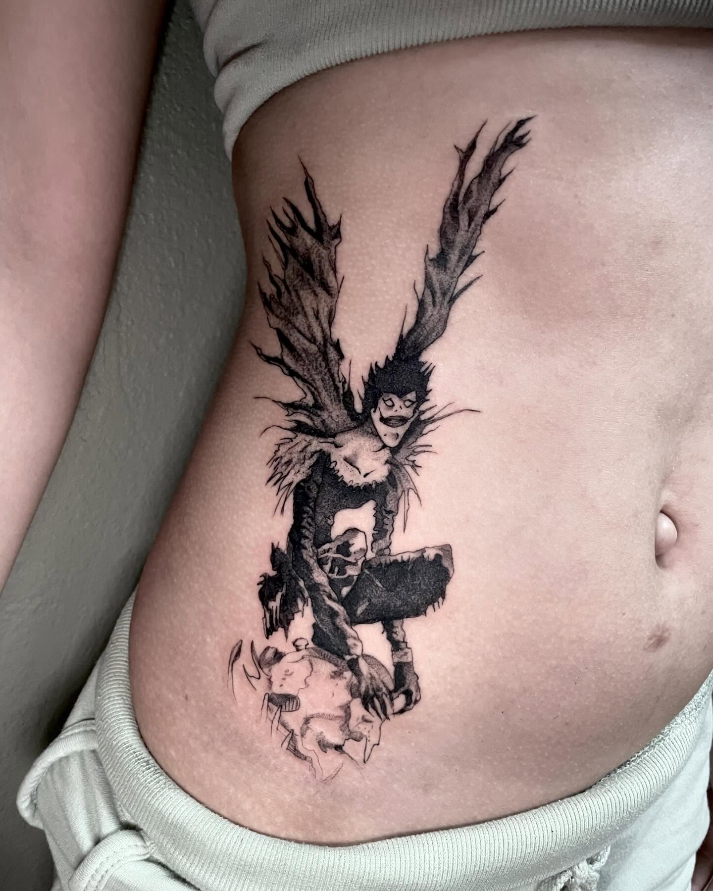 Anime character anime tattoo on the ribs by Bryan