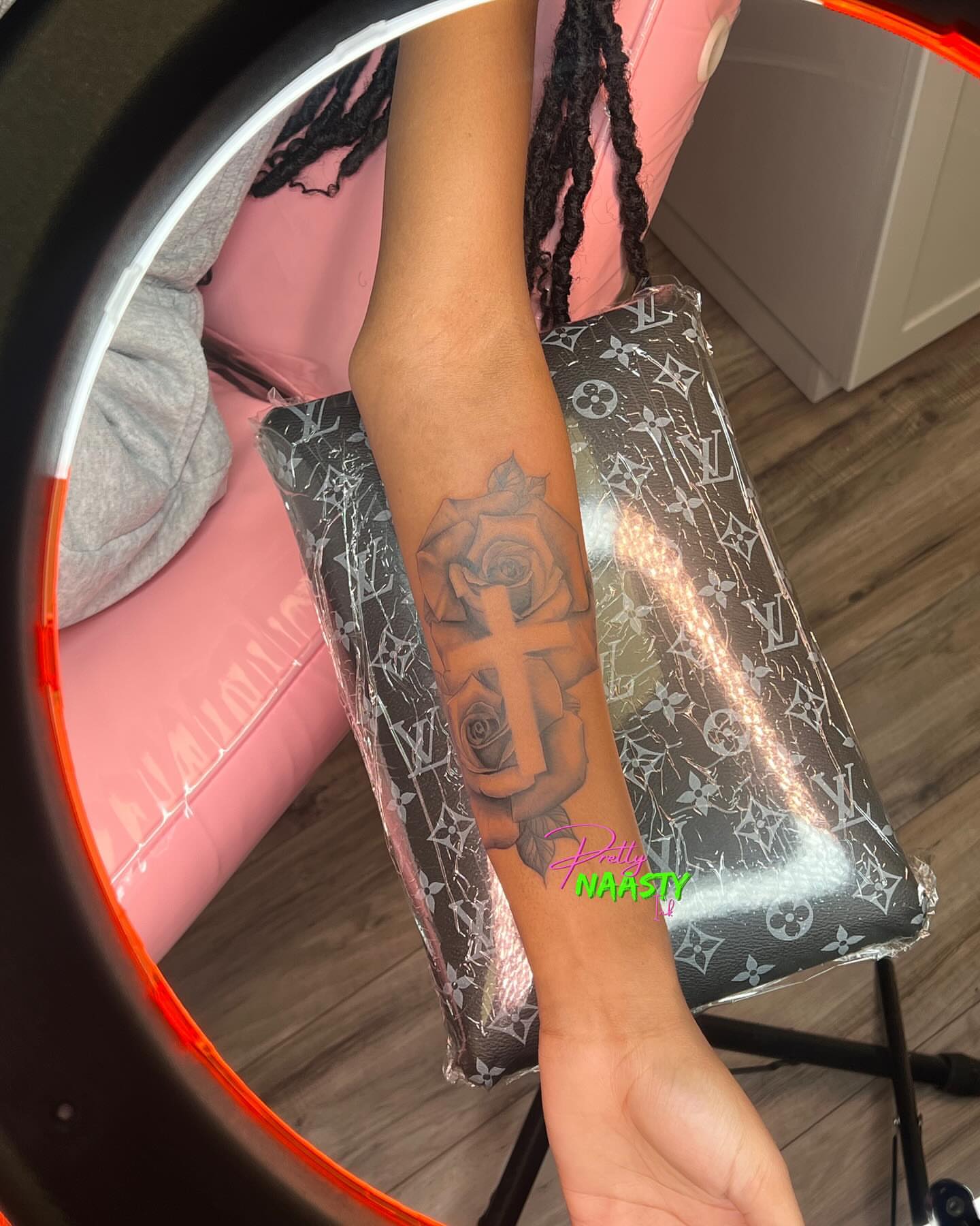 Cross and roses black and grey tattoo on the forearm by Pretty Naasty Ink🖤