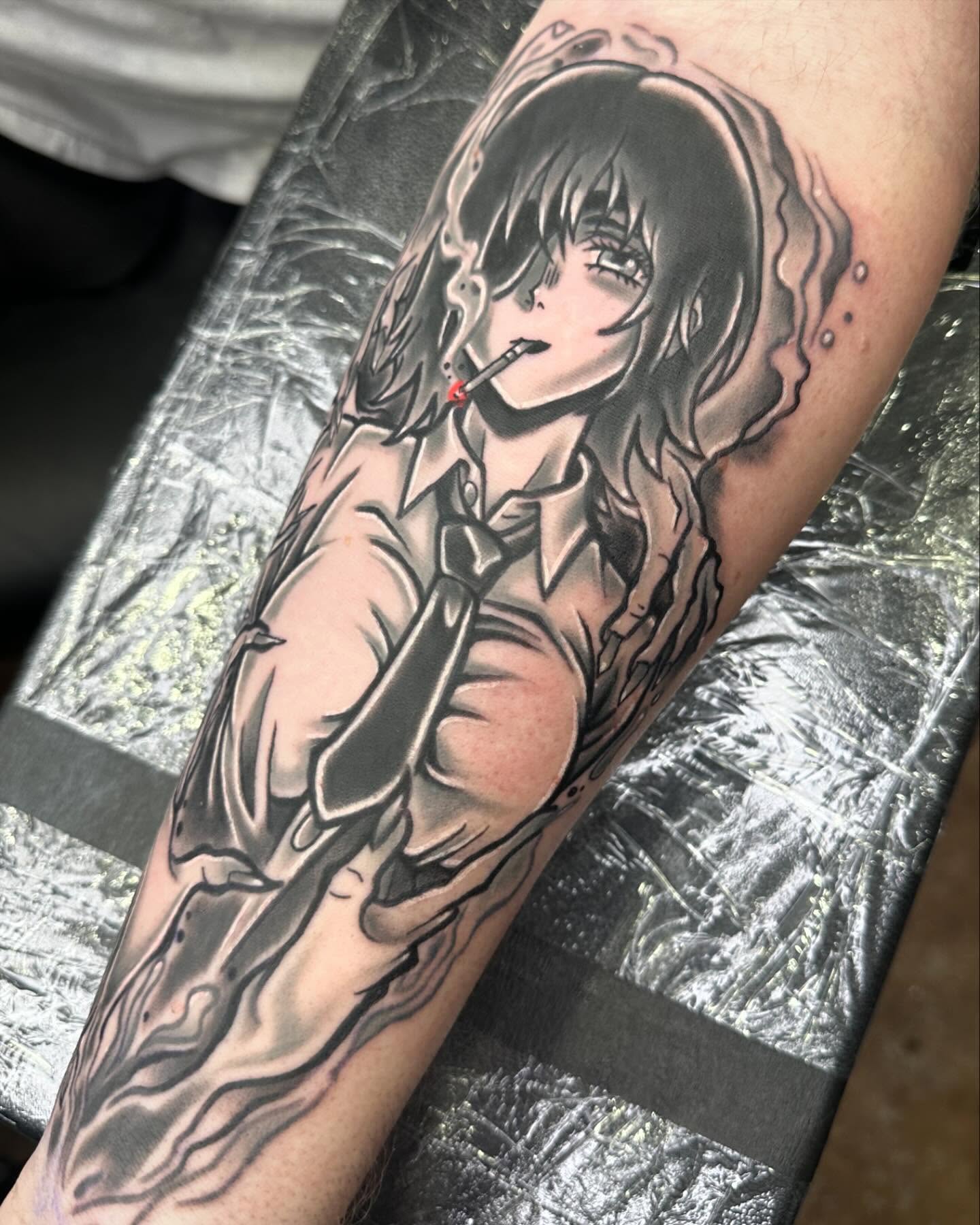 Anime character anime tattoo on the forearm by Jeremy Thomas