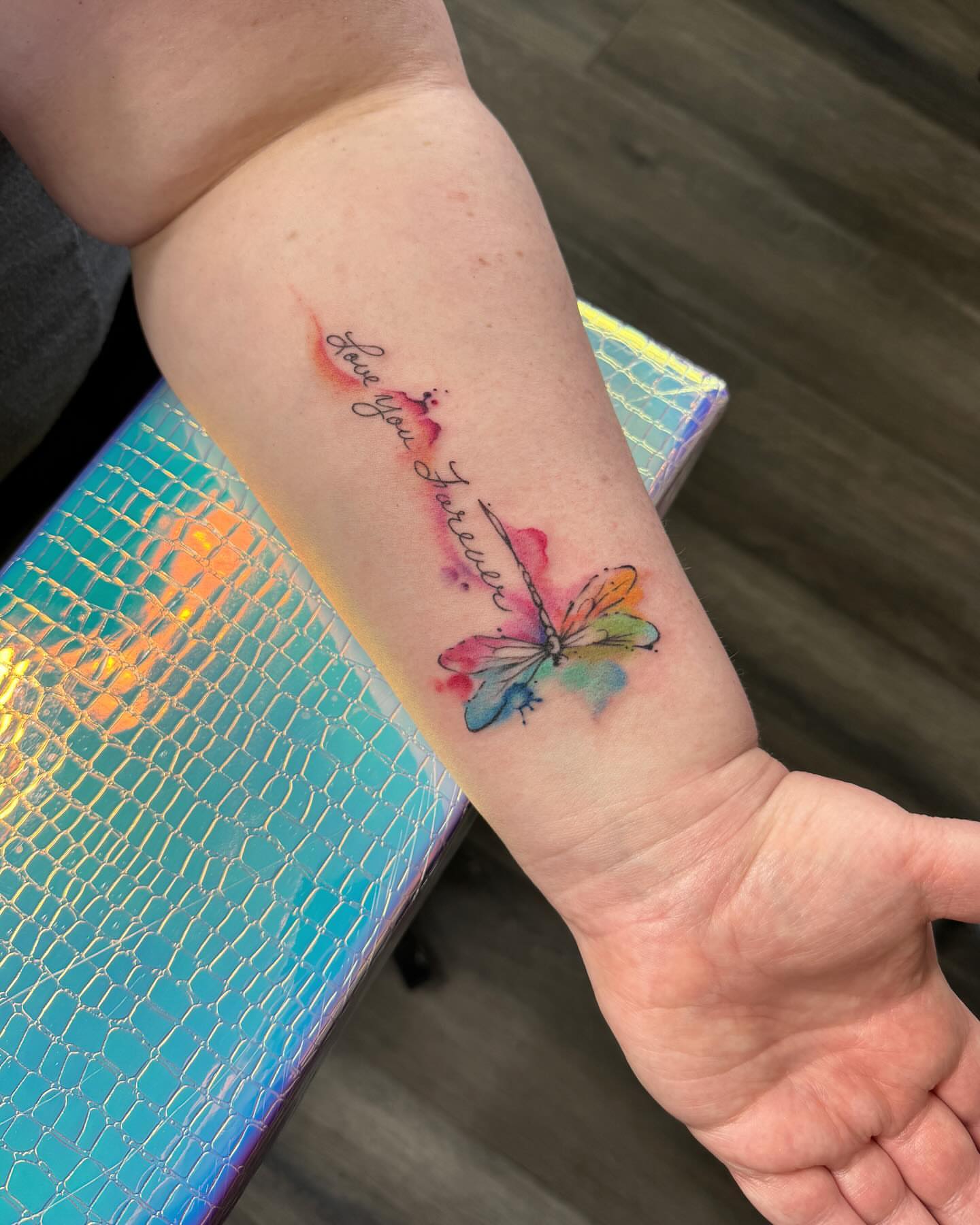 Butterfly watercolor tattoo on the forearm by Robyn Mahon