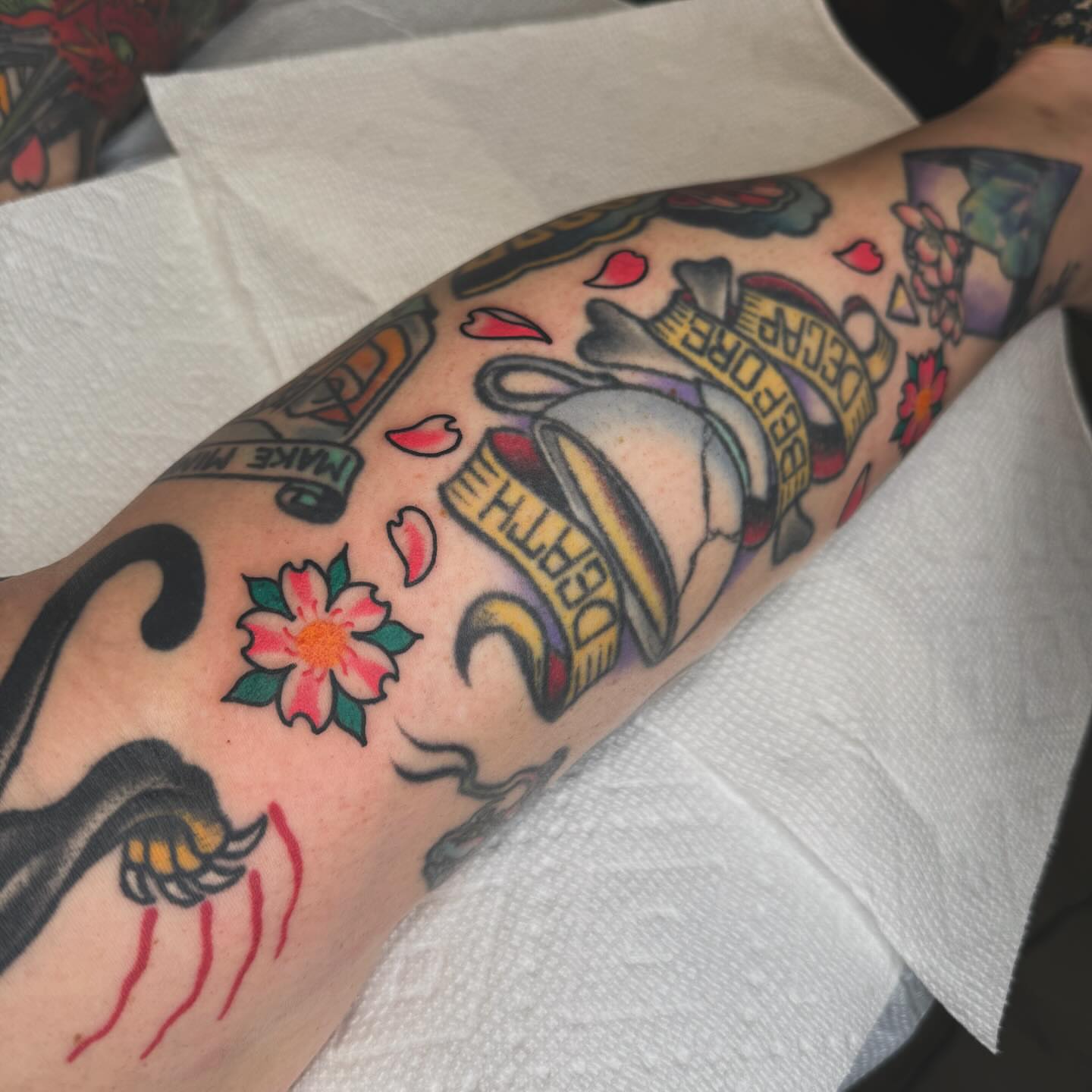 Bell and flower American traditional tattoo on the forearm by Liz Mercer ★ Tattooer - Raleigh NC