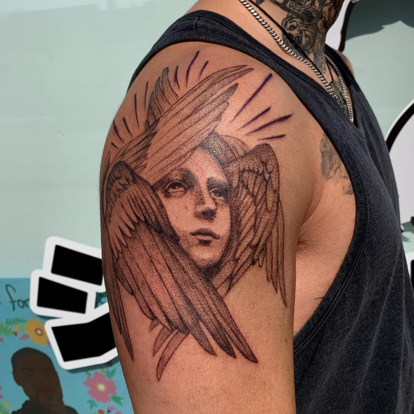 Angelic figure dotwork tattoo on the shoulder by Maddy Paige