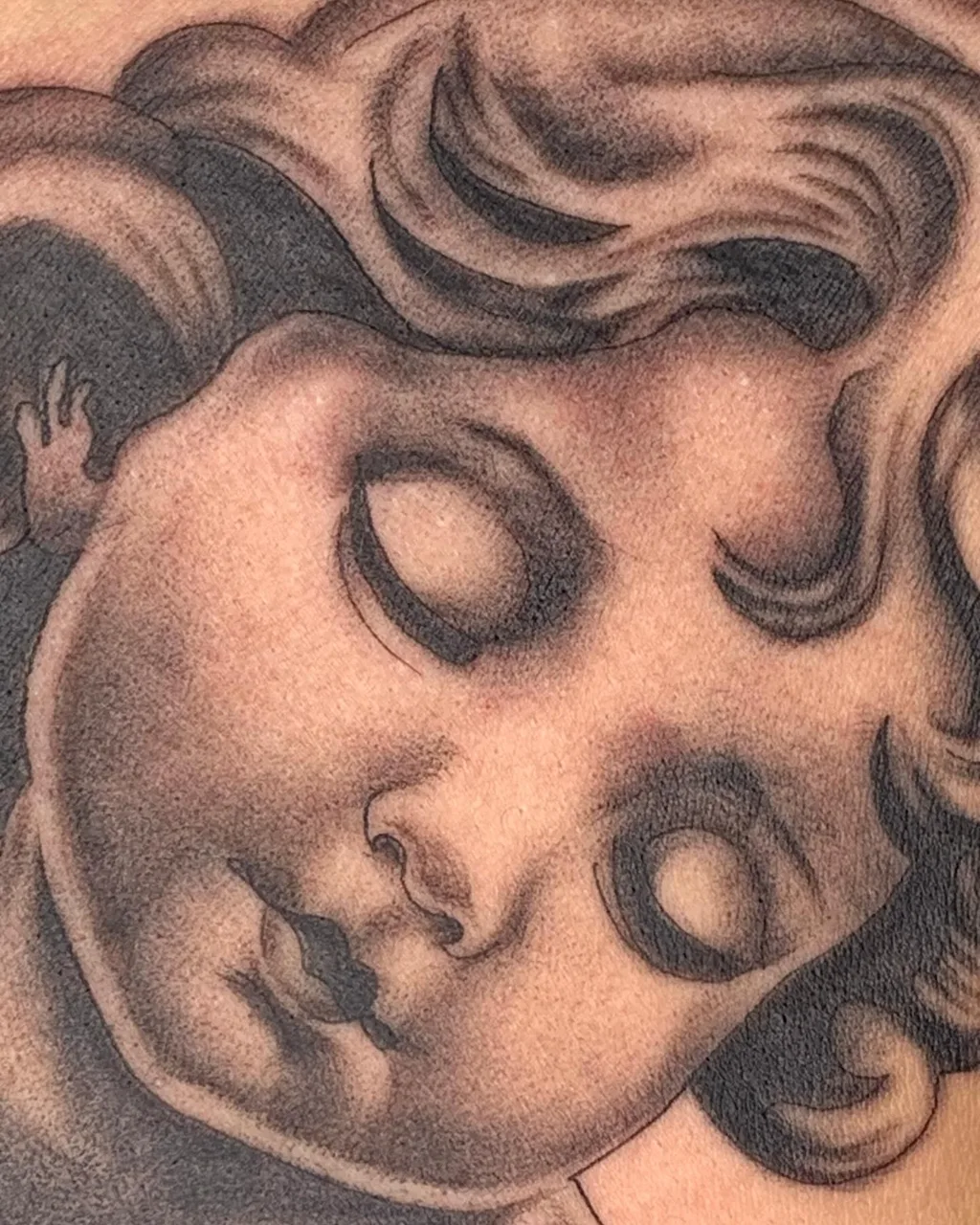 Child's face black and grey tattoo by Savana ☆