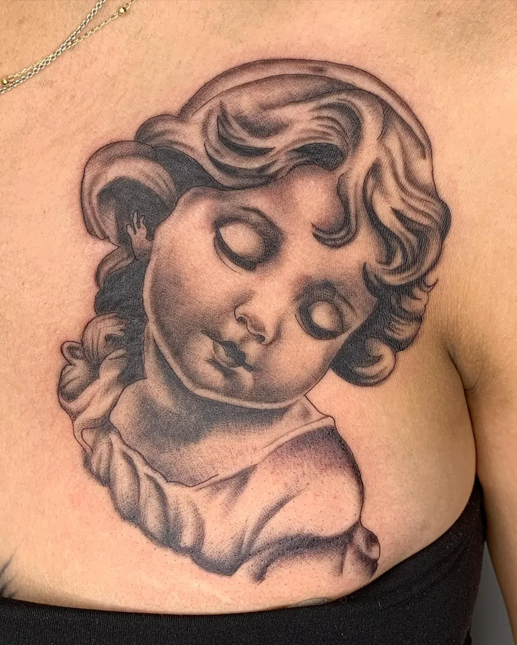 Angelic cherub black and grey tattoo on the chest by Savana ☆