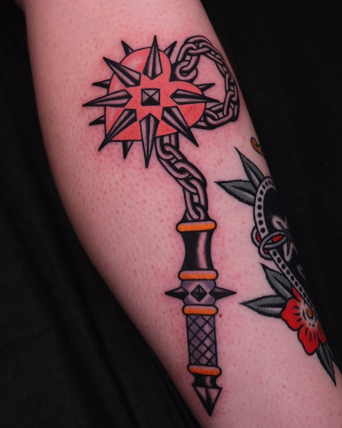 Key and compass American traditional tattoo on the forearm by Chaz Otto