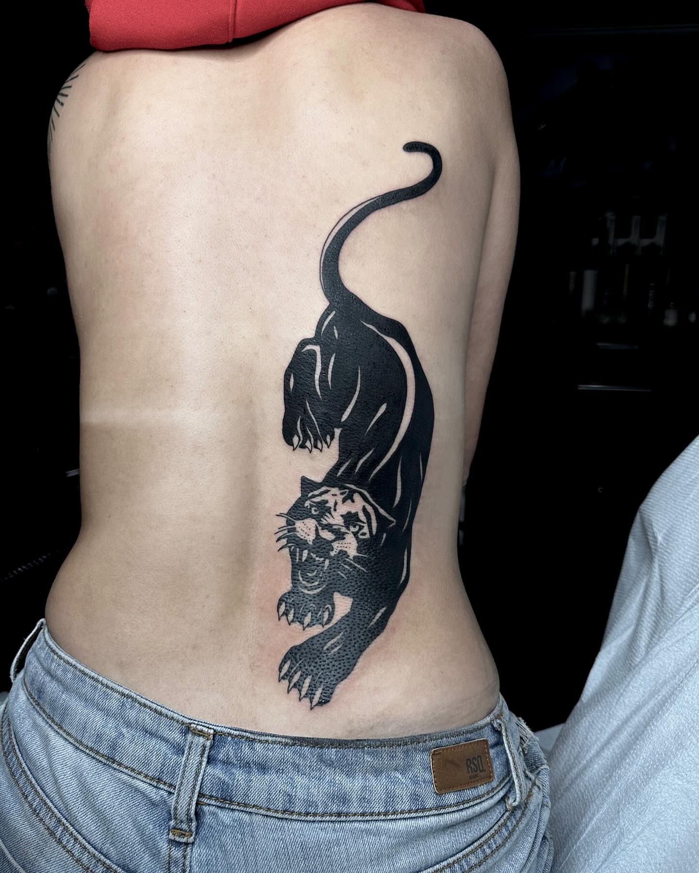 Panther black and grey tattoo on the ribs by Emersyn DeLuna