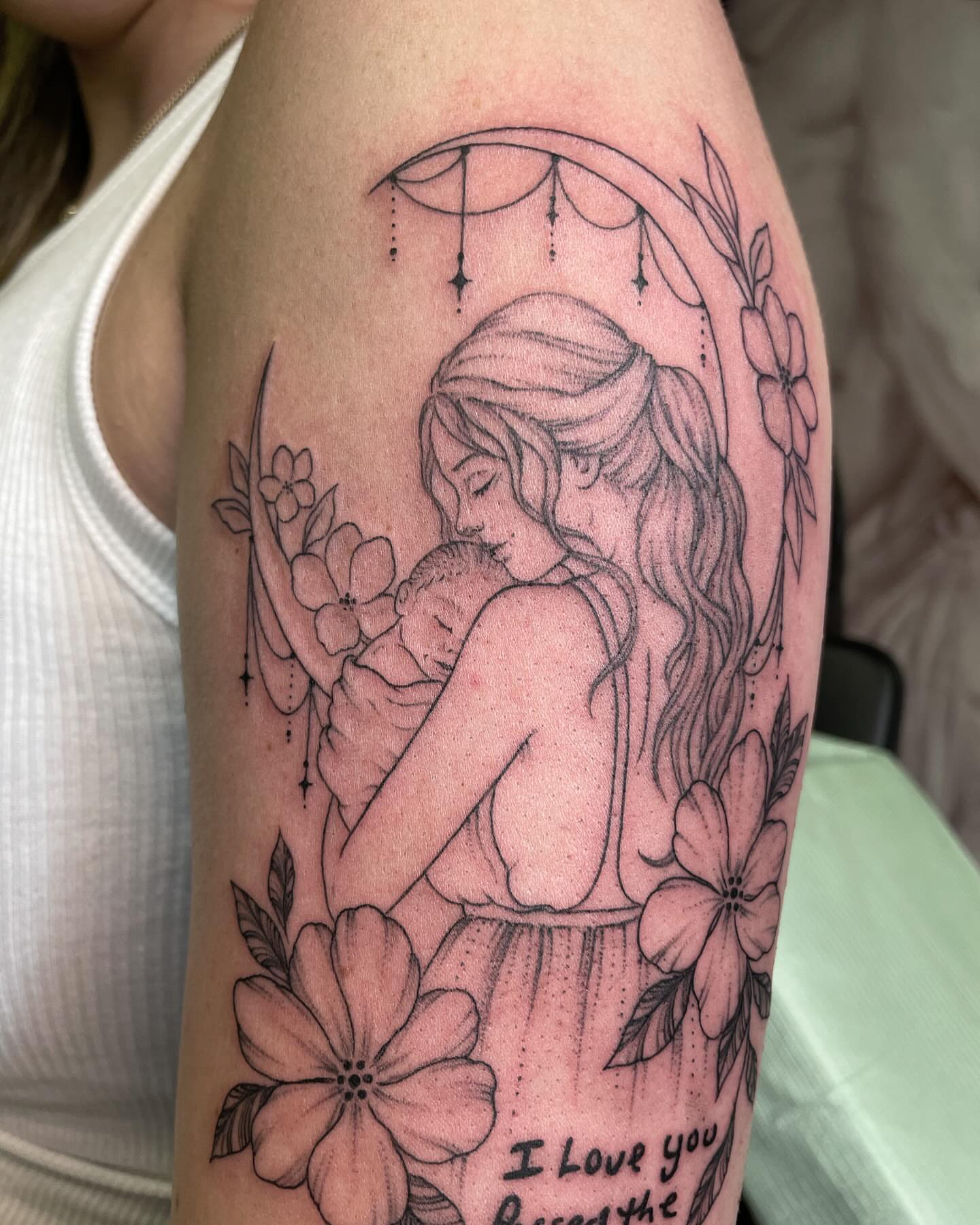 Mother and child black and grey tattoo on the forearm by @jettaturas, New City, New York