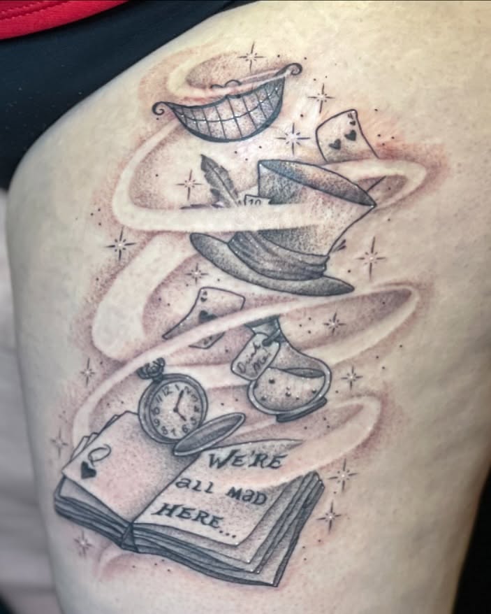 Alice in Wonderland black and grey tattoo on the shoulder by Dani McBay
