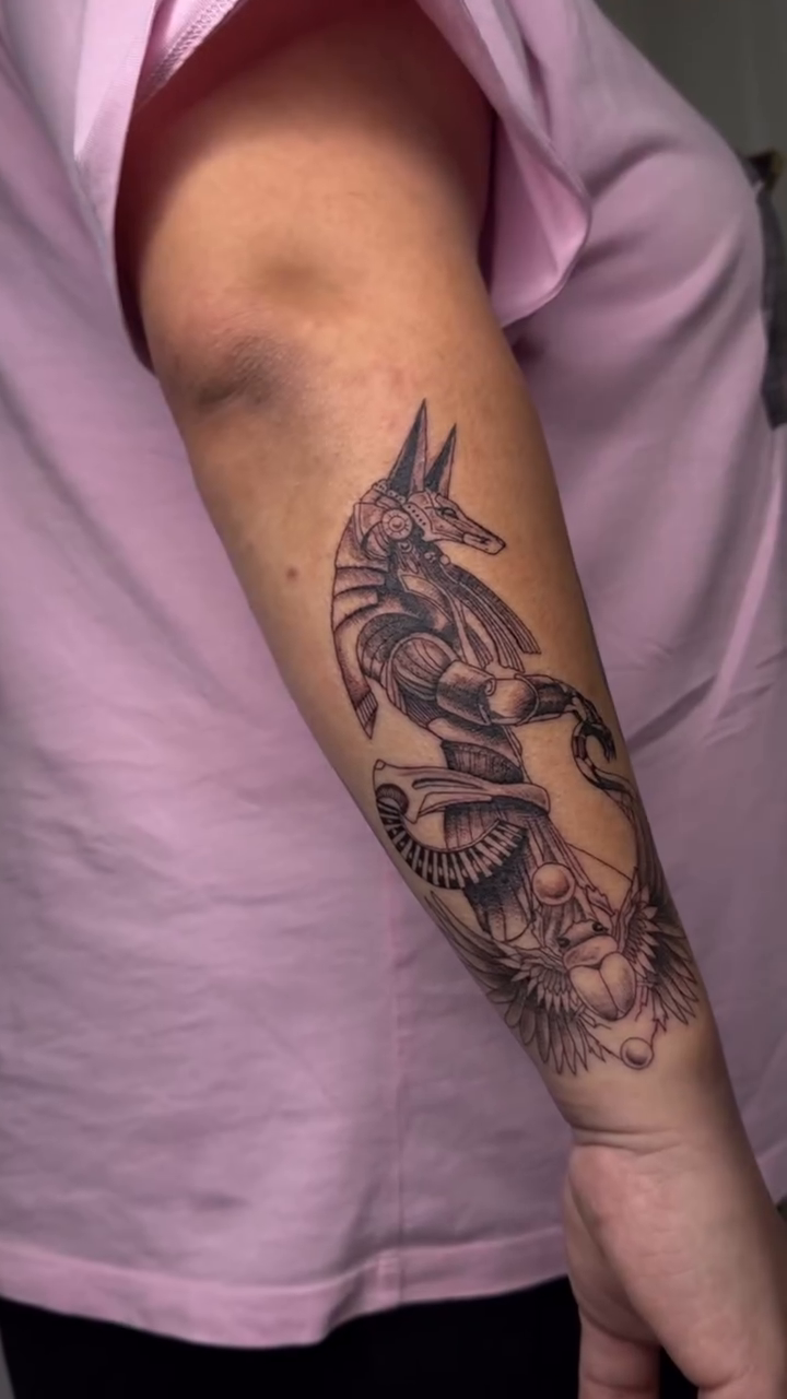 Anubis and lion fine line tattoo by Dee, San Diego, California