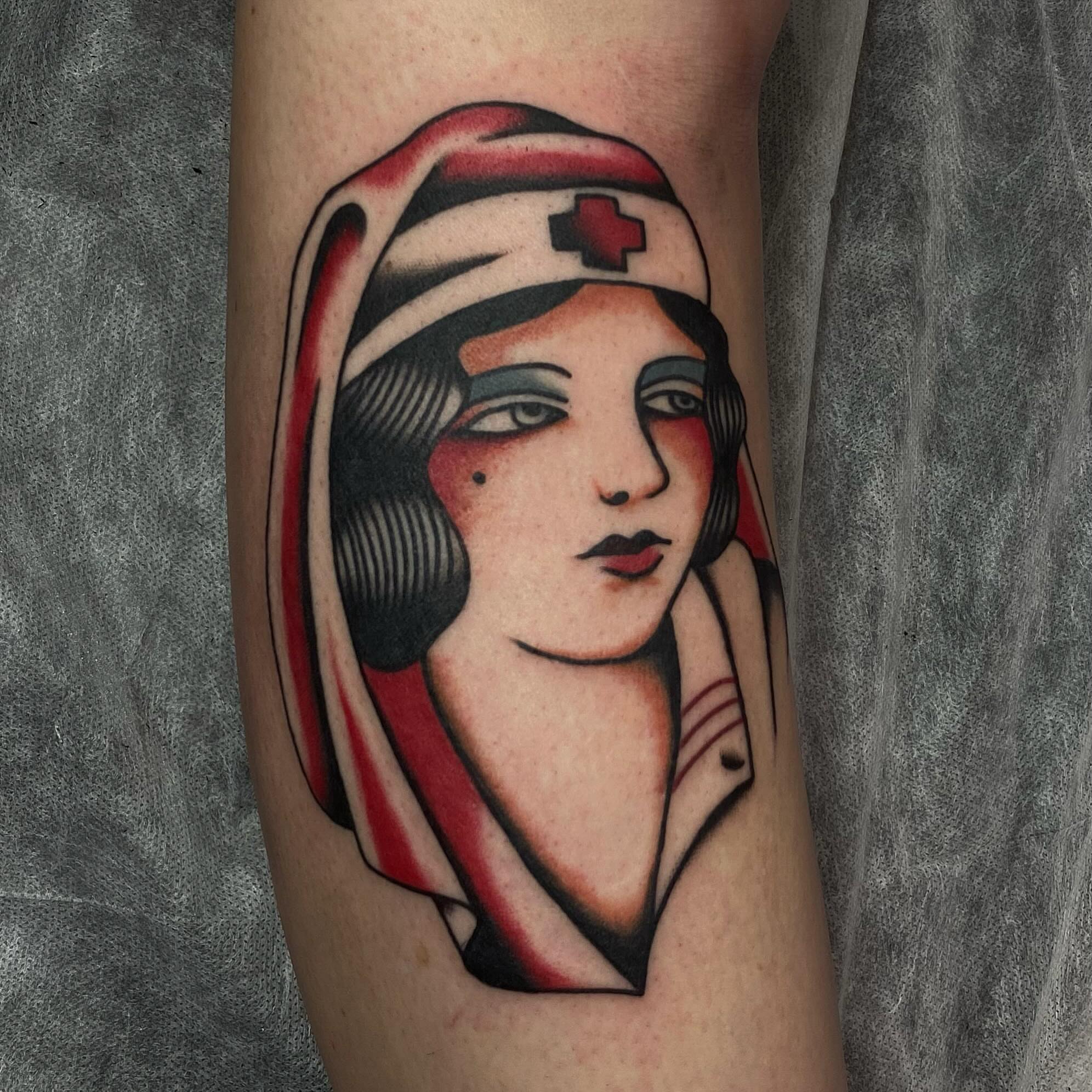 Nurse American traditional tattoo on the forearm by Erin Chambers
