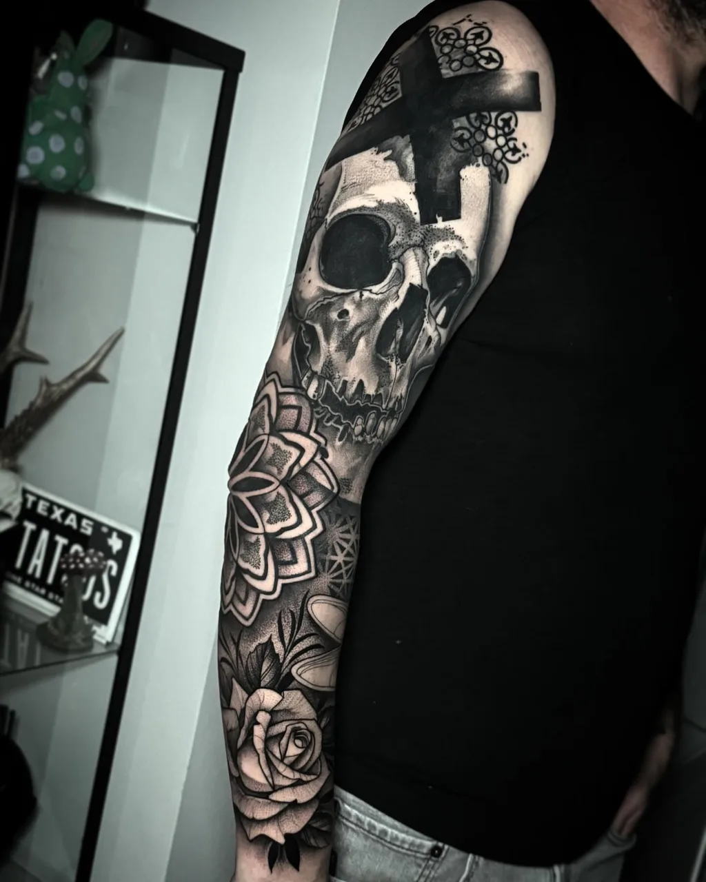 Skull and cross realism tattoo on the forearm by David Mushaney