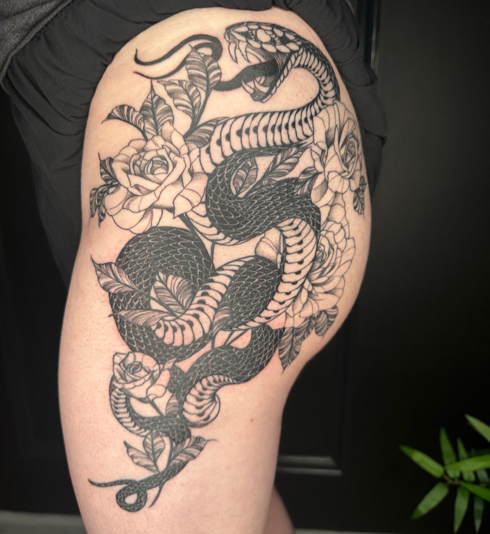 Snake and roses black and grey tattoo on the thigh by 𝕵𝖊𝖘𝖘𝖆 𝕭𝖎𝖌𝖊𝖑𝖔𝖜, Harrison, New Jersey