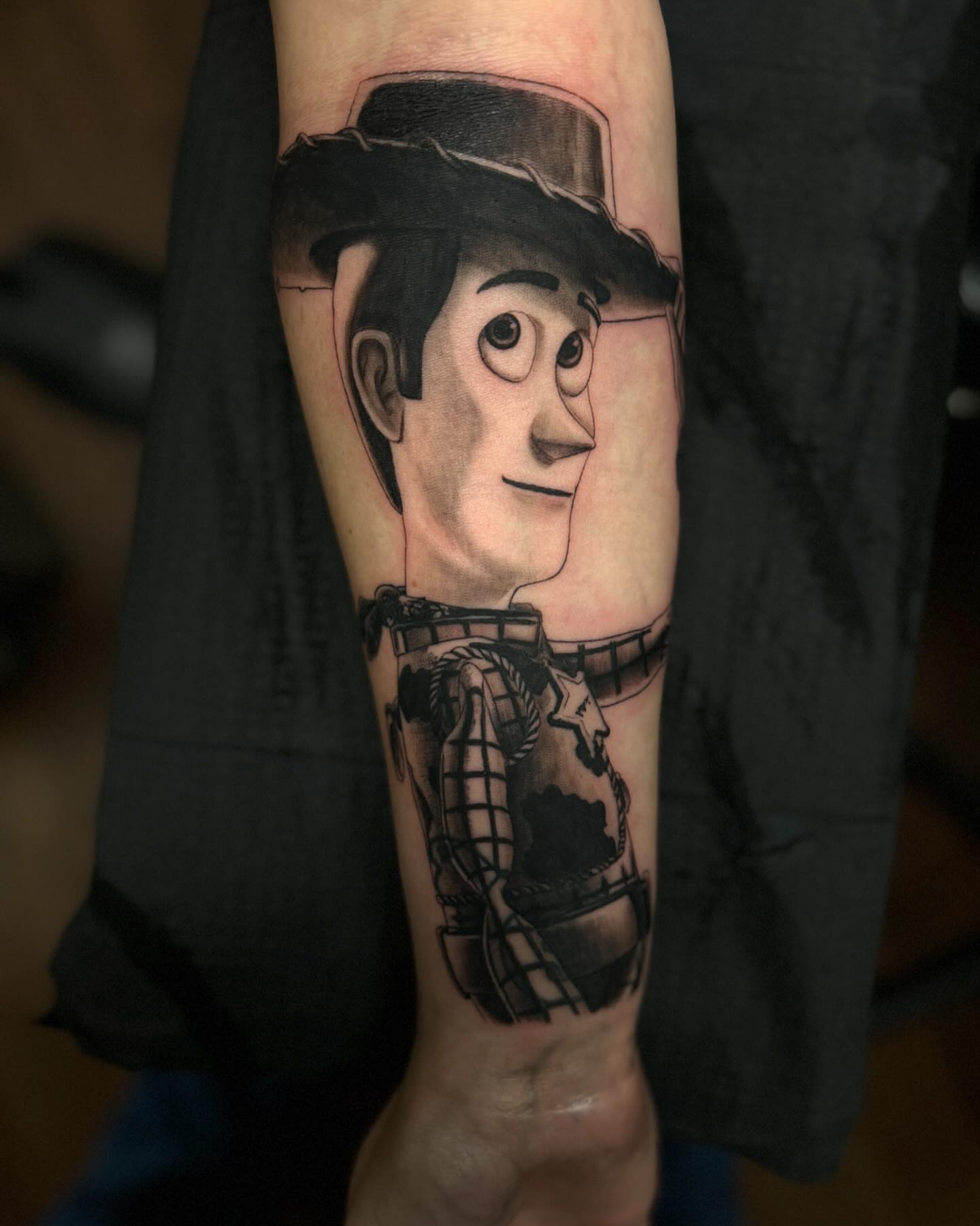 Toy character black and grey tattoo on the forearm by Paul Jack II ⚜️ Tattoo Artist ⚜️Atlanta