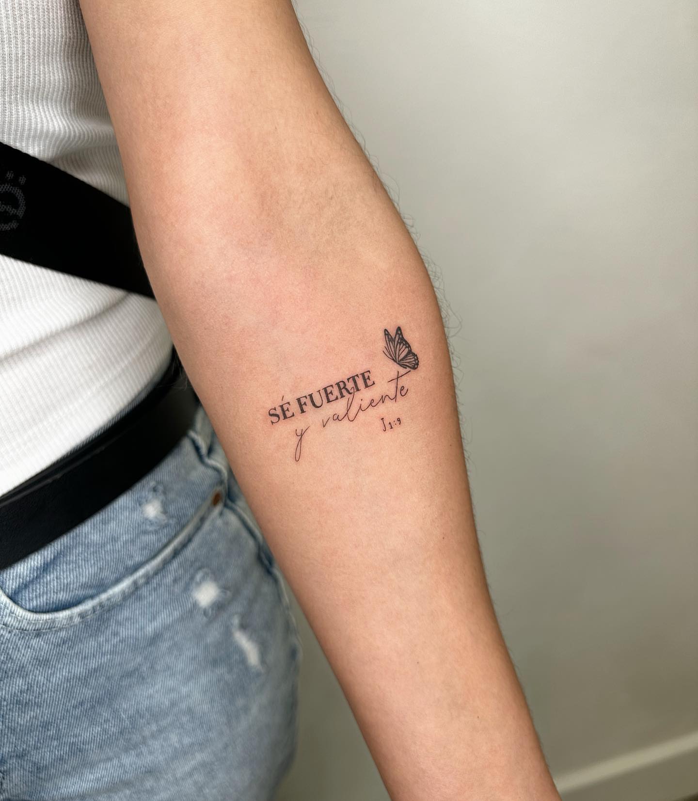 Motivational phrase lettering script tattoo on the forearm by oc fine line & tiny tattoos