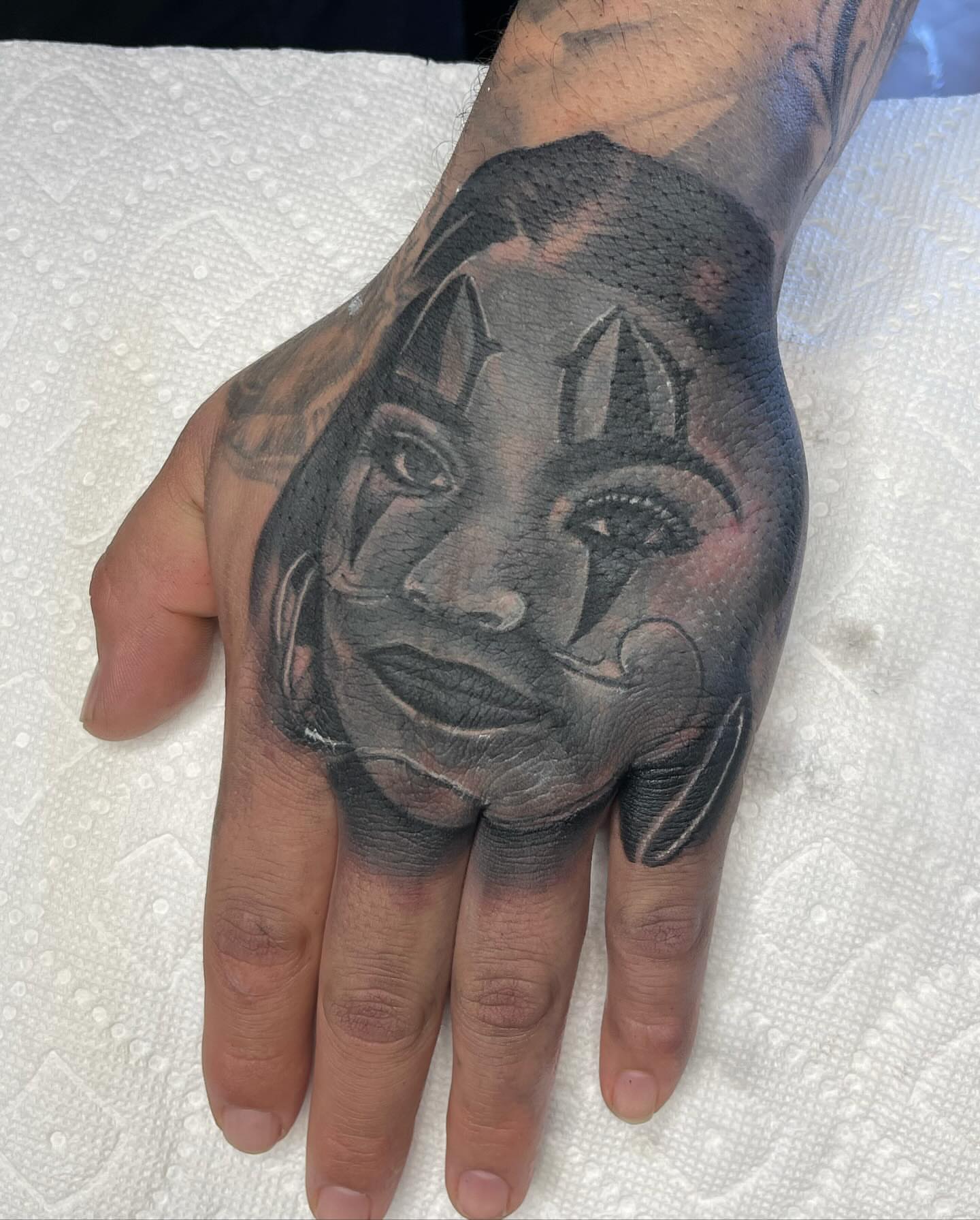 Woman's face realism tattoo on the hand by LOS
