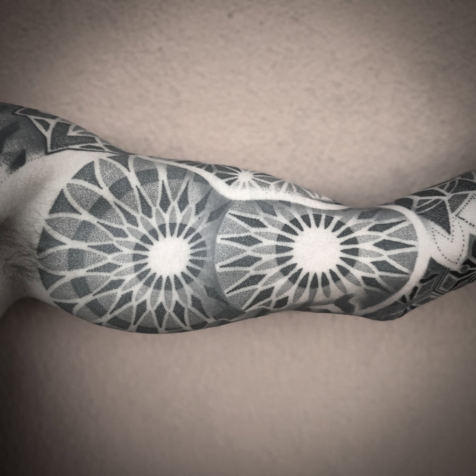 Geometric pattern dotwork tattoo on the forearm by Donovan hernandez