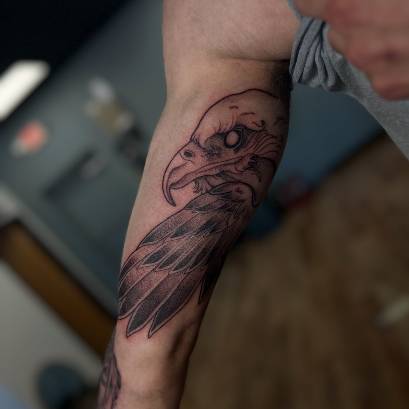 Eagle head black and grey tattoo on the forearm by alex h🪴 neotrad