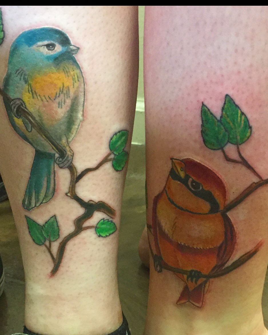 Bird watercolor tattoo on the leg by Bobby Glennon