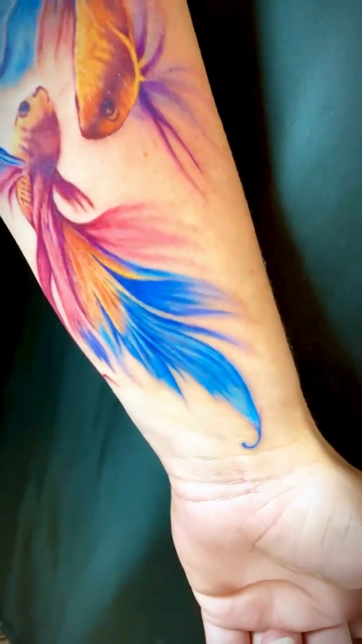 Two betta fish realism tattoo by Charlotte Tattoo Artist