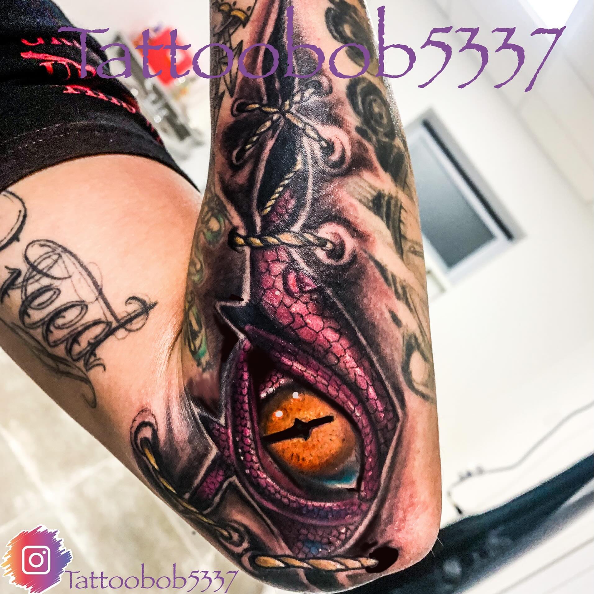 Dragon eye realism tattoo on the forearm by Bobby Glennon